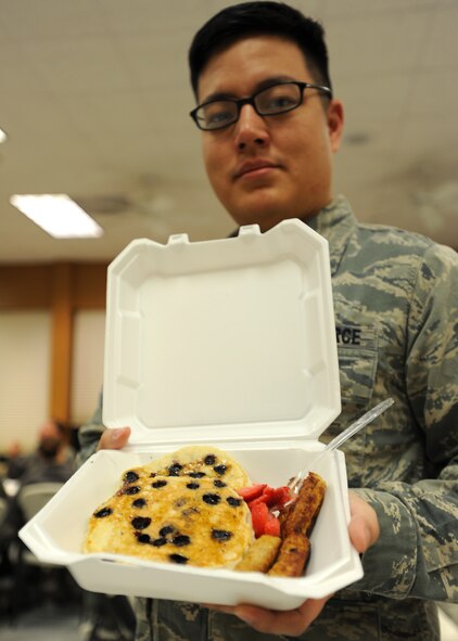 Senior Airman Jason Pfieffer, 319th Comptroller Squadron, displays his blueberry pancake breakfast Jan. 11, 2013, at Sven's Den on Grand Forks Air Force Base, N.D. Members of the 319th Air Base Wing First Sergeants Council provided an all-you-can-eat breakfast for Airmen as a fundraiser for future wing events. (U.S. Air Force photo/Airman 1st Class Xavier Navarro)