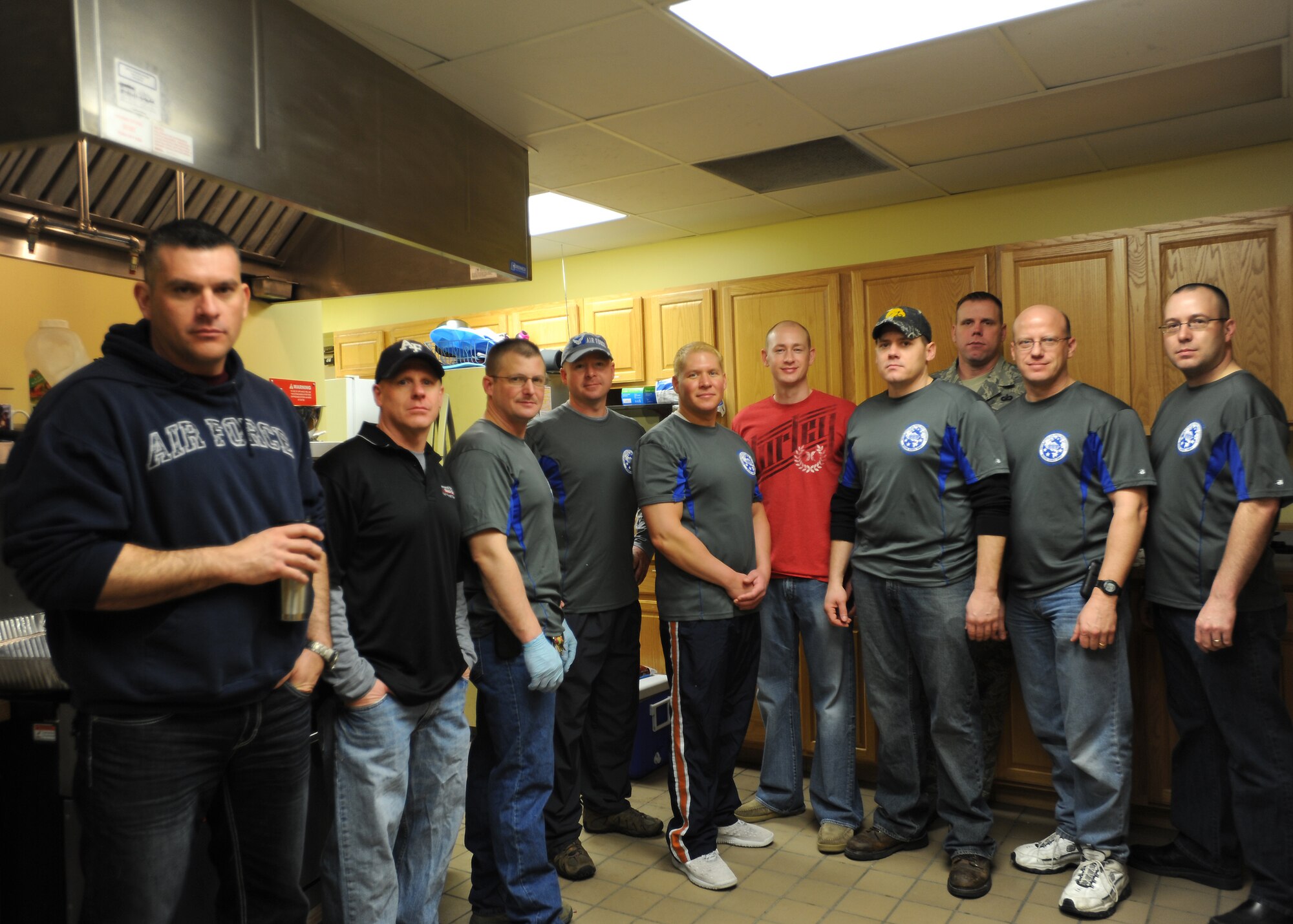 The First Sergeants Council from the 319th Air Base Wing takes a group picture at Sven's Den on Jan. 11, 2013, before cooking an all-you-can-eat pancake breakfast for Airmen on Grand Forks Air Force Base, N.D.  The event was held as a fundraiser for future wing events. (U.S. Air Force photo/Airman 1st Class Xavier Navarro)