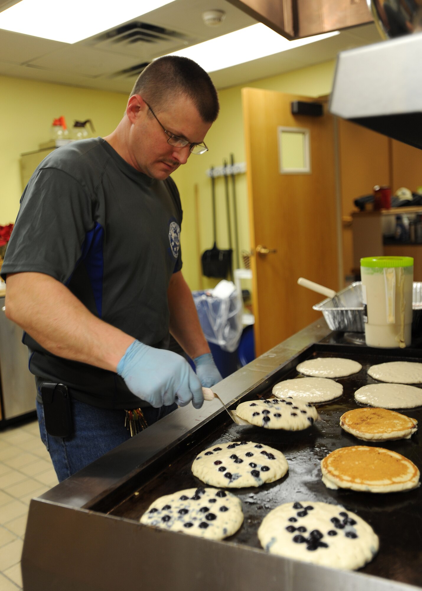 Master Sgt. Brian Dipersio, 319th Medical Group first sergeant, cooks blueberry pancakes Jan. 11, 2013, at Sven's Den on Grand Forks Air Force Base, N.D. The First Sergeants Council here cooked an all-you-can-eat pancake breakfast for base Airmen as a fundraiser for future wing events. (U.S. Air Force photo/Airman 1st Class Xavier Navarro)