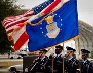 The wind whips through the flags held by the Eglin honor guard during the Senior Airman Josh Santos memorial Jan. 13 at Duke Field. Santos passed away Nov. 26 from colon cancer.  He was a radio operator with the 711th Special Operations Squadron.  During the memorial, it was announced the Duke Field gym would be renamed Santos Strength in his honor.  (U.S. Air Force photo/Tech. Sgt. Samuel King Jr.)