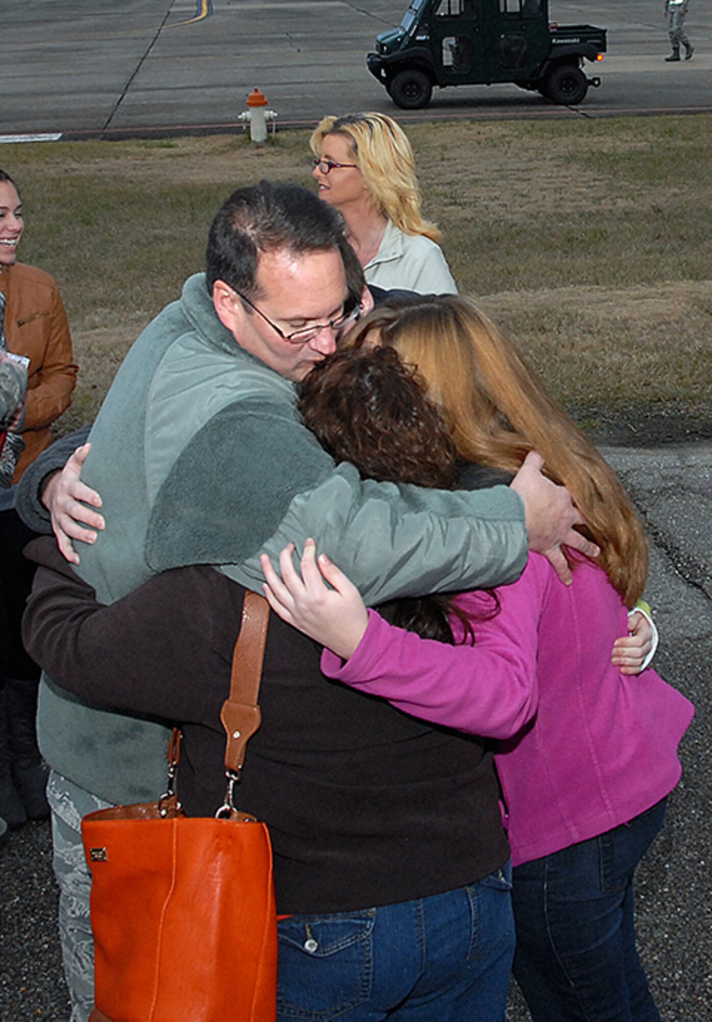 Master Sgt. Samuel Cutright gives his family one last embreace before deploying to Southwest Asia. (Air Force photo by Gene H. Hughes)