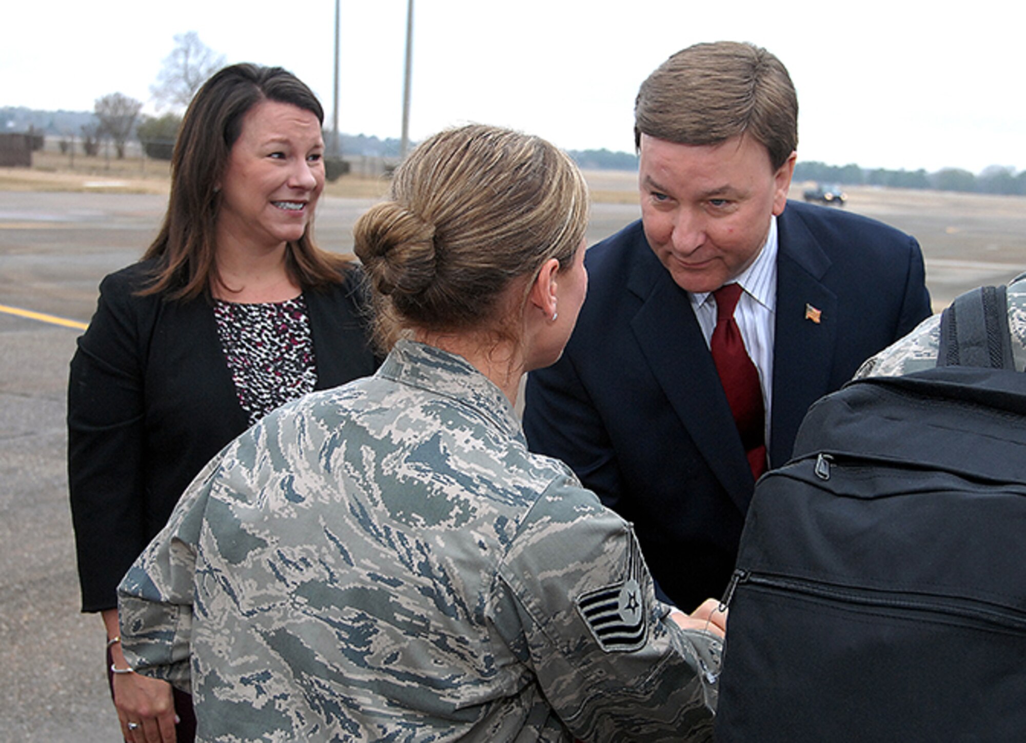 U.S. Representatives Martha Roby and Mike Rogers shake hands with deploying menbers of the 908th Airlift Wing as they embark a C-130 bound for Southwest Asia. (Air Force photo by Gene H. Hughes)