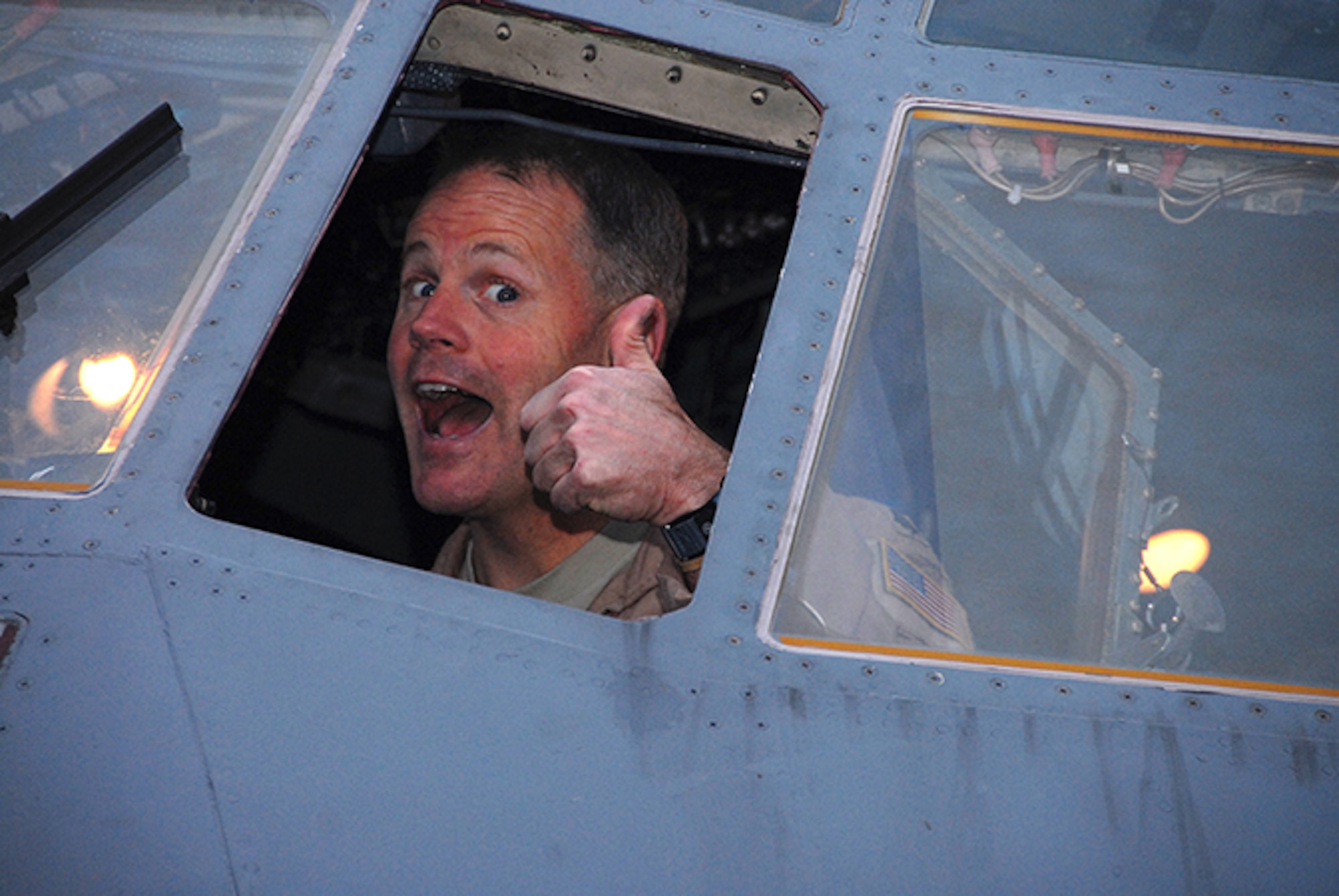 Lt. Col. Dave Hughes of the 357th Airlift Squadron gives an enthusiastic thumbs up before taking off for Southwest Asia. (Air Force photo by Gene H. Hughes)