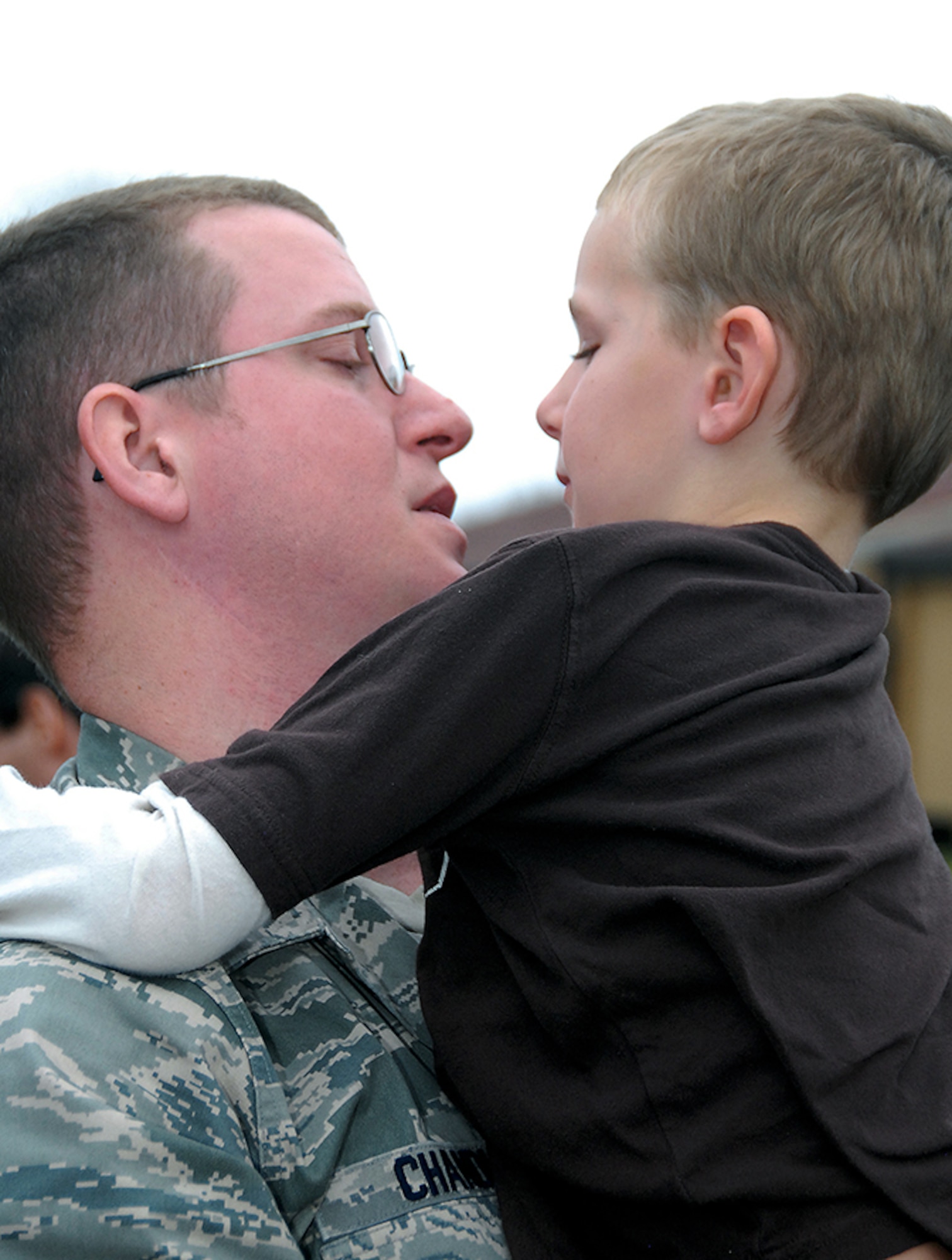 Tech. Sgt. Matthew Chandler bids farewell to his son prior to deploying to Southwest Asia. (Air Force photo by Gene H. Hughes)