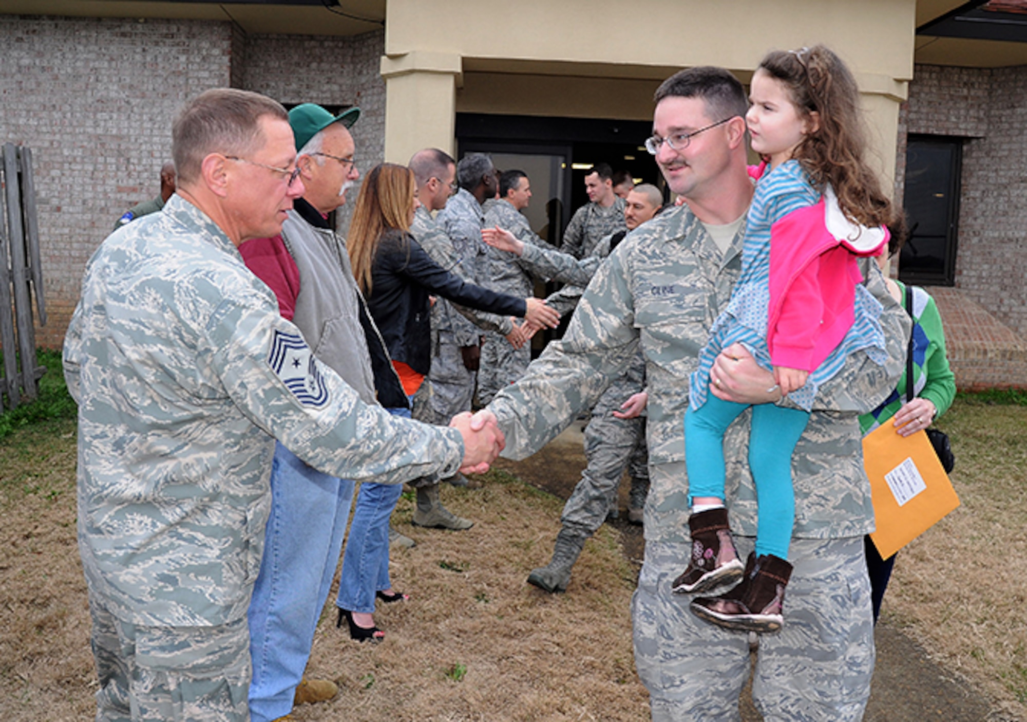 Chief Master Sgt. Owen Duke, 908th command chief, gives his best wishes to Tech. Sgt. Dana Cline. (Air Force photo by Lt. Col. Jerry Lobb)