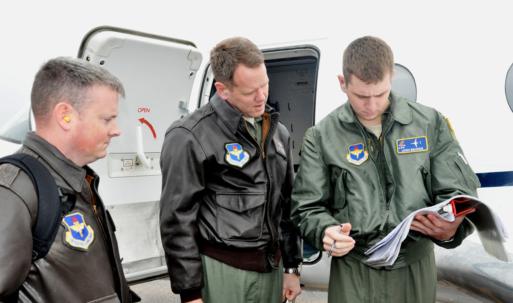 Col. Brett Pennington, 14th Operations Group commander, starts his aircraft preflight inspection with student pilot 2nd Lt. Josh Bauder, SUPT Class 13-05 with Air Education and Training Command evaluator Maj. William Dorsey looks on.  The Aircrew Standards and Evaluation Visit from headquarters AETC scheduled 14 flying check rides with the 14th OG instructors and is part of the Consolidated Unit Inspection.  (U.S. Air Force Photo/Sonic Johnson)