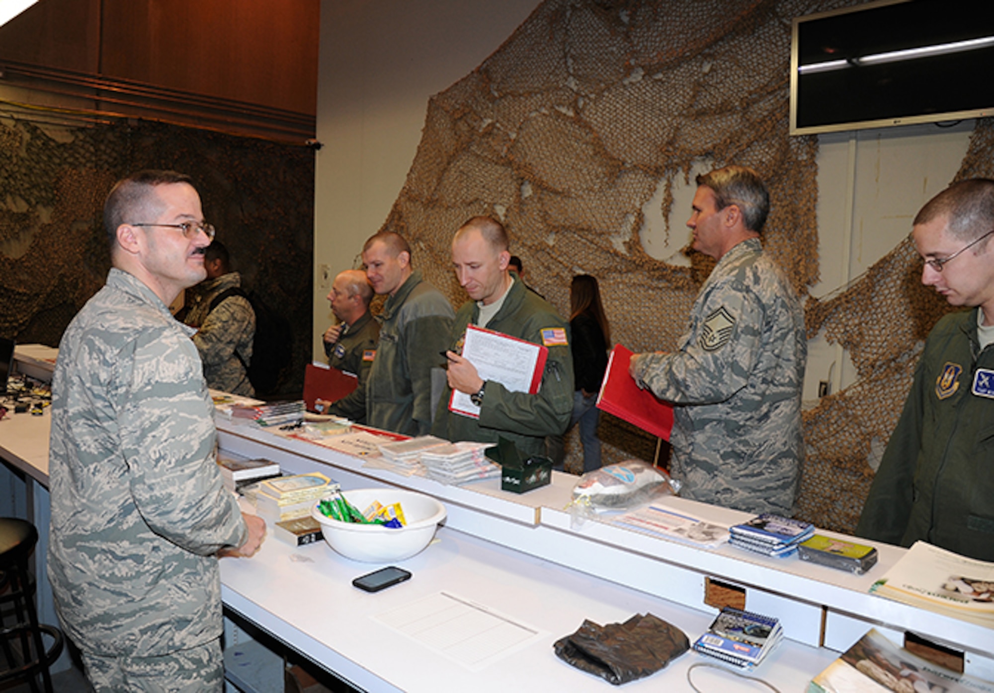 Outprocessing Airmen check in with Maj. (CH) Jamie Danforth prior to deployment to Southwest Asia (Air Force photo by Lt. Col. Jerry Lobb)