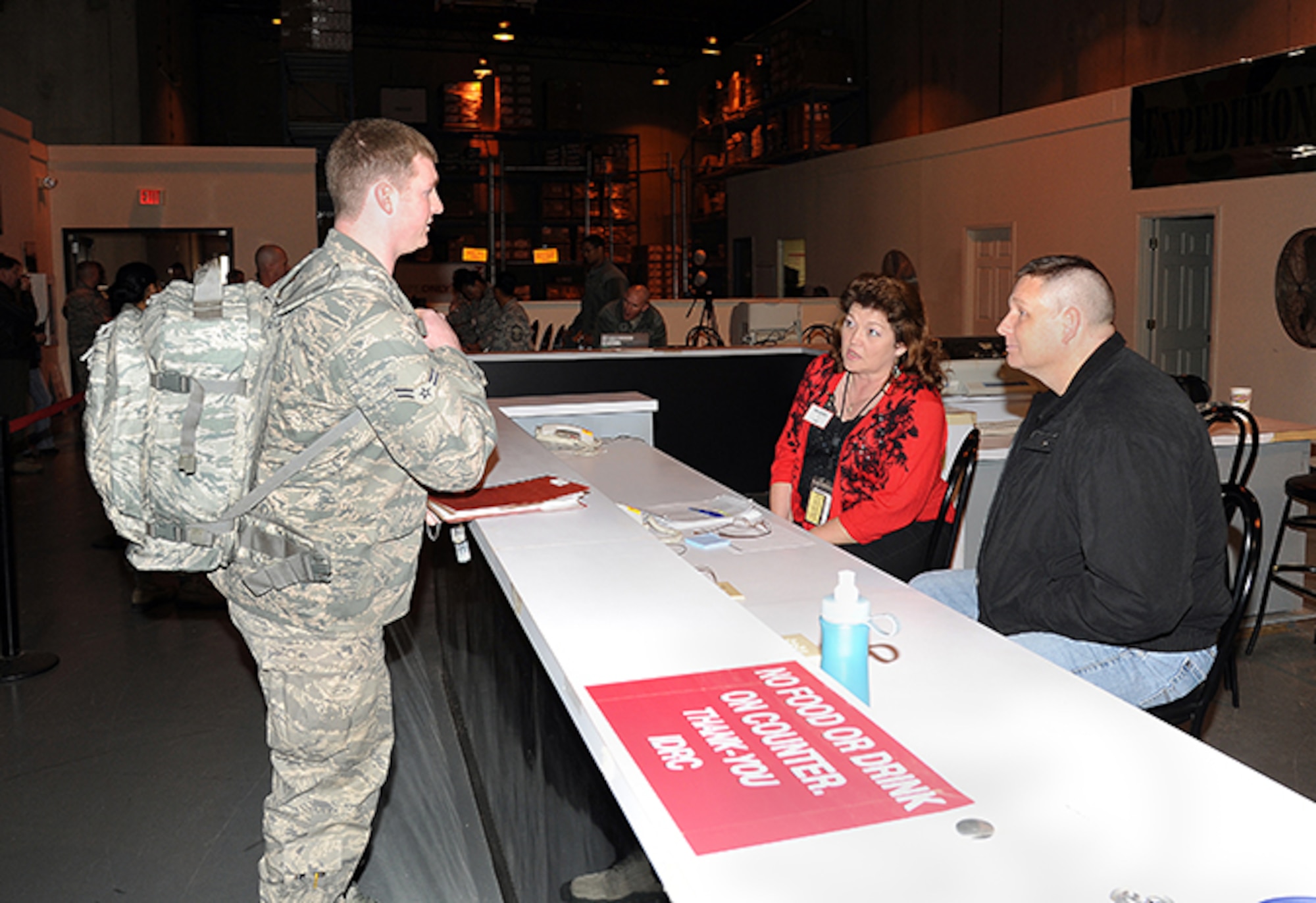 Airman First Class Bryan Renforth checks his orders and pay with 908th Finance Office personnel Debbie Smith and Billy Kidd. (Air Force photo by Lt. Col. Jerry Lobb)