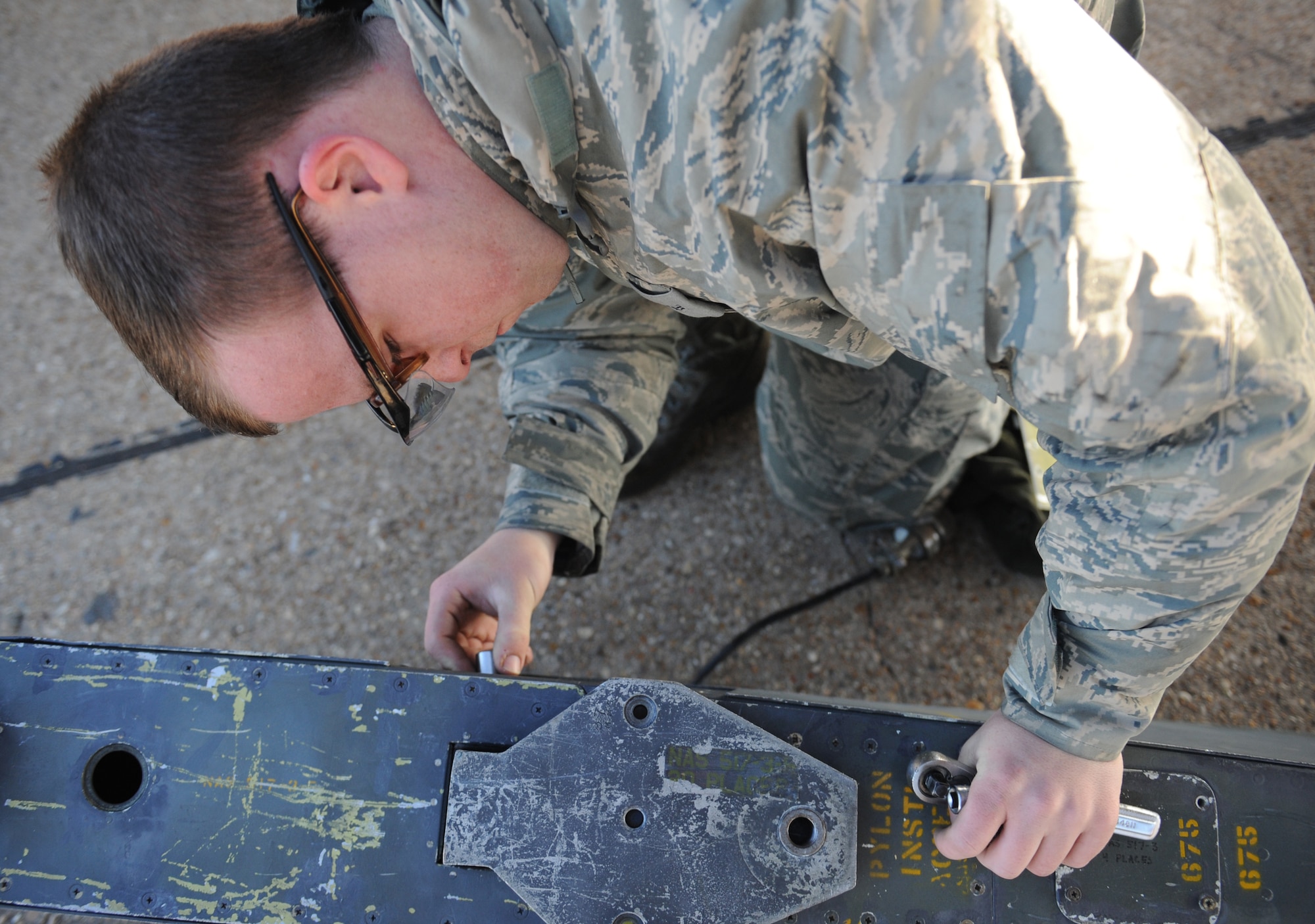 Airman 1st Class David Kofler, 2nd Aircraft Maintenance Squadron weapons, removes a panel from an ALE-25 on Barksdale Air Force Base, La., Jan. 17. Kofler prepared the ALE-25 for installation on a B-52H Stratofortress. The ALE-25 is the interface between the LITENING Pod and aircraft. (U.S. Air Force photo/Airman 1st Class Benjamin Gonsier)