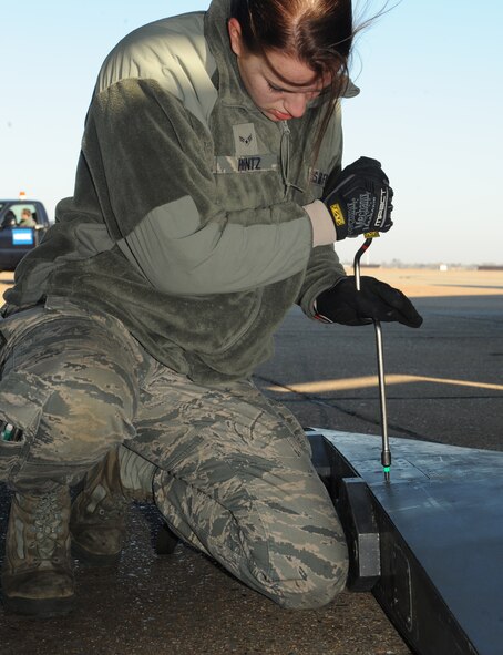 Airman 1st Class Eva Hintz, 2nd Aircraft Maintenance Squadron weapons, tightens a screw on an ALE-25 on Barksdale Air Force Base, La., Jan. 17. The ALE-25 is the interface between the LITENING Pod and aircraft. The pods help aircrews verify targets, communicate with controllers and direct laser guided munitions. (U.S. Air Force photo/Airman 1st Class Benjamin Gonsier)