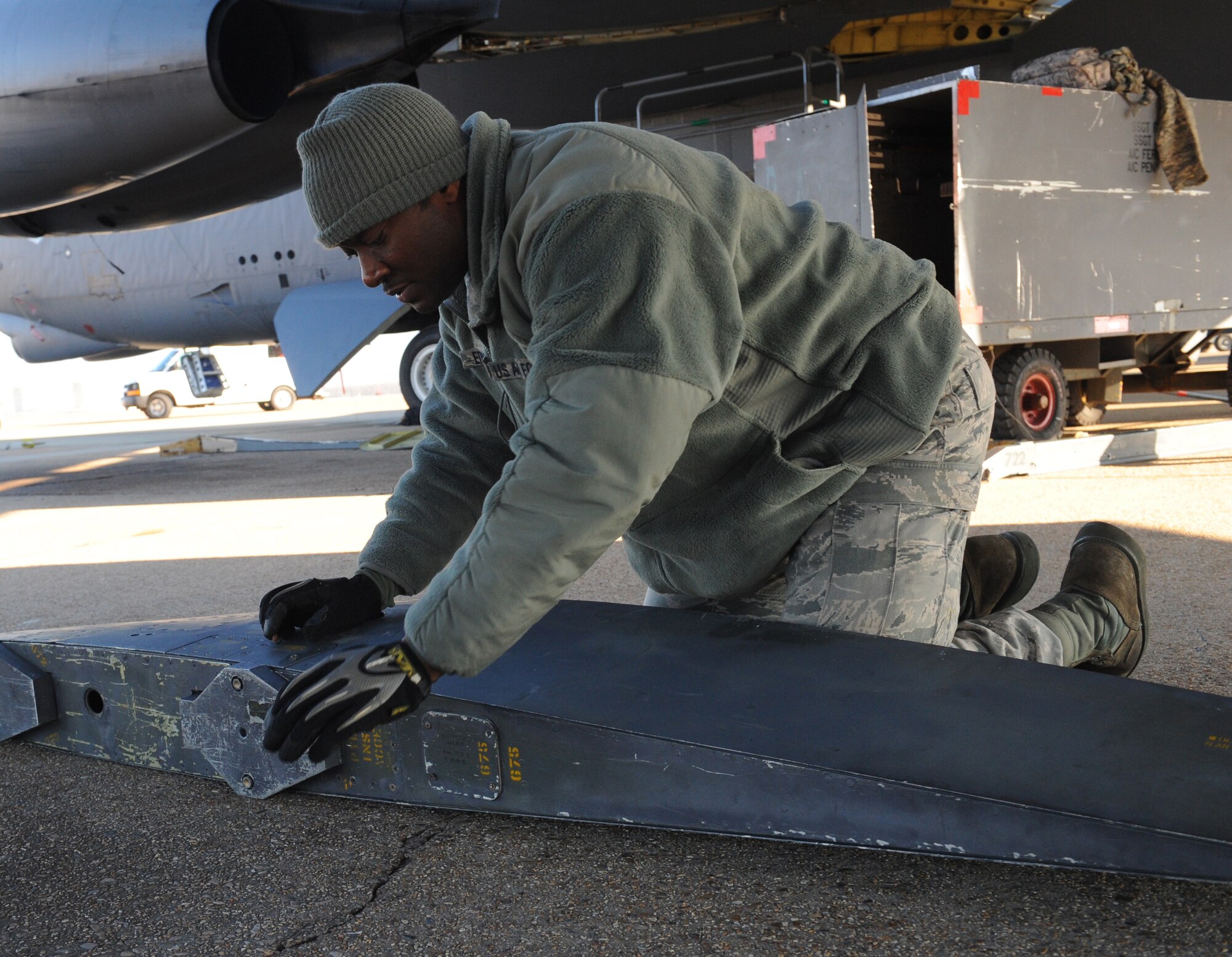 Staff Sgt. Kevin Edwards, 2nd Aircraft Maintenance Squadron weapons, looks for areas on an ALE-25 that need to be sanded on Barksdale Air Force Base, La., Jan. 17. Edwards prepped the ALE-25 for installation on a B-52H Stratofortress. The ALE-25 is the interface between the LITENING Pod and aircraft. The pods help aircrews verify targets, communicate with controllers and direct laser guided munitions. (U.S. Air Force photo/Airman 1st Class Benjamin Gonsier)
