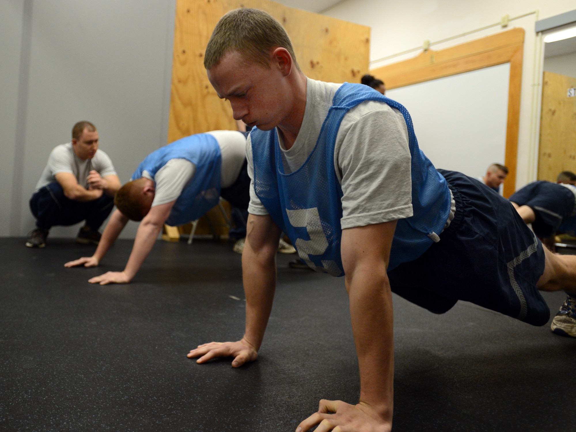 U.S. Air Force Airman 1st Class Colin Hundt, 20th Civil Engineer Squadron entomologist, performs the push-up portion of the physical training evaluation at Shaw Air Force Base, S.C., Jan. 16, 2013. Since October 2012, military members have taken over conducting physical training tests. (U.S. Air Force photo taken by Senior Airman Tabatha Zarrella/released)