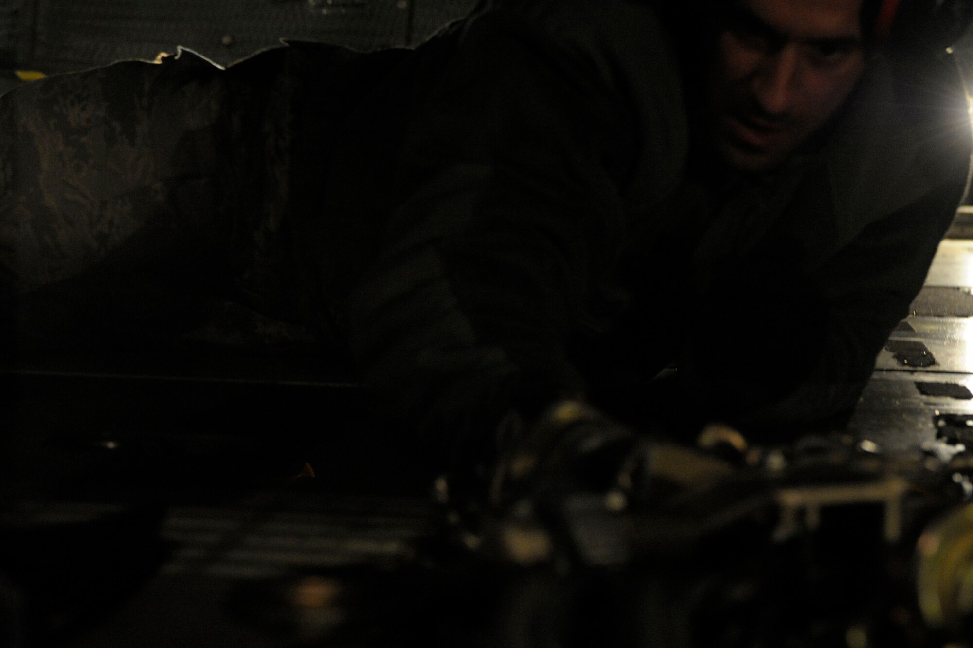Tech. Sgt. Alfred Daprato, 728th Air Mobility Squadron, piles chains and hooks under an U.S. Army M983A2 Transport, Jan 5,2013. Six Patriot missile batteries from the United States, Germany, and the Netherlands are deployed to Turkey as part of a NATO led coalition that will augment Turkey's air defense capabilities and contribute to the de-escalation of the crisis along the border. (U.S. Air Force photo by Staff Sgt. Daniel Owen/Released)                               