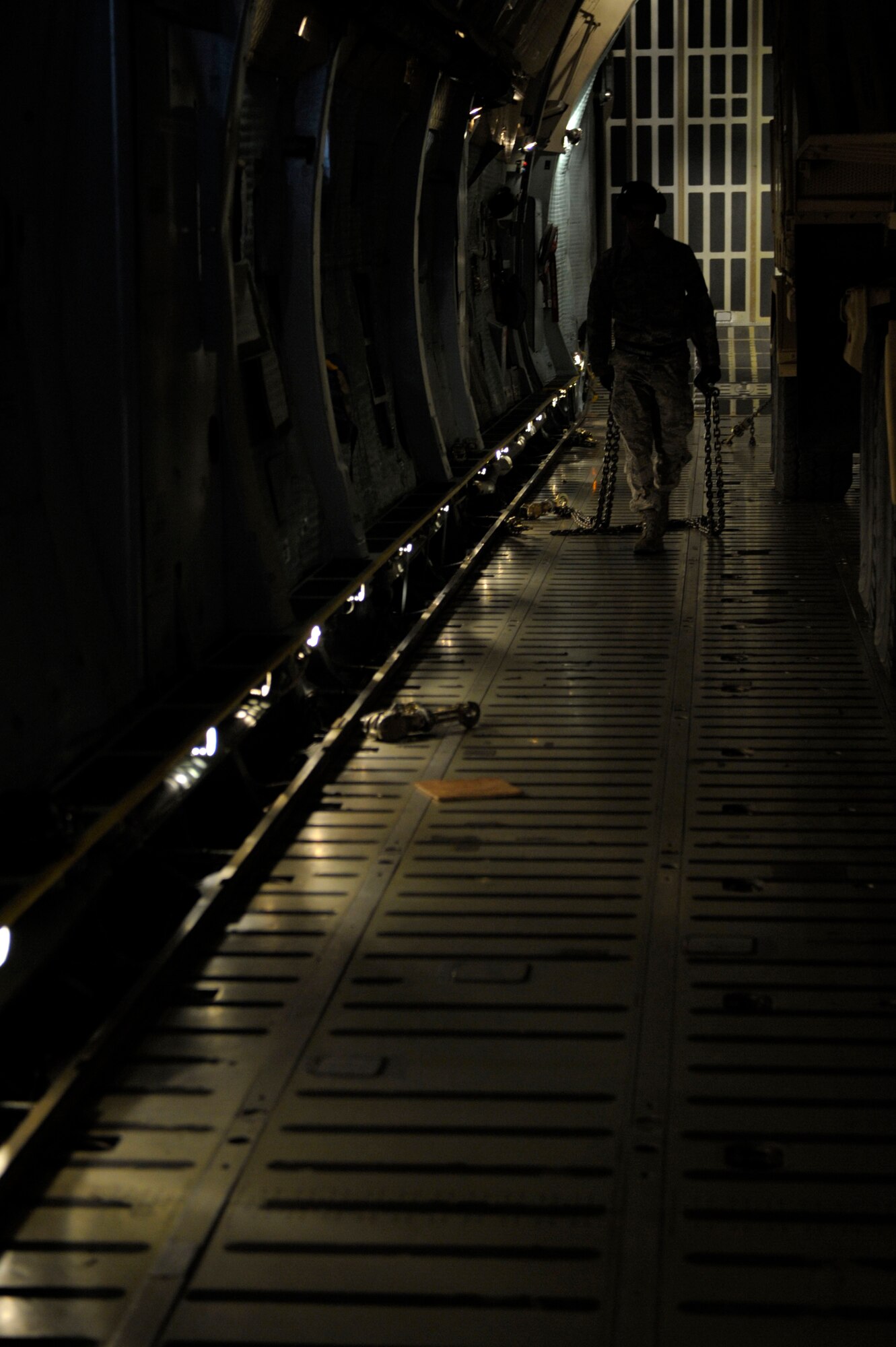 A U.S. Airman from the 728th Air Mobility Squadron at Incirlik Air Base, Turkey, stows tie down chains on a C-5 Galaxy on Jan 05, 2013. Six Patriot missile batteries from the United States, Germany, and the Netherlands are deployed to Turkey as part of a NATO led coalition that will augment Turkey's air defense capabilities and contribute to the de-escalation of the crisis along the border. (U.S. Air Force photo by Staff Sgt. Daniel Owen/Released)