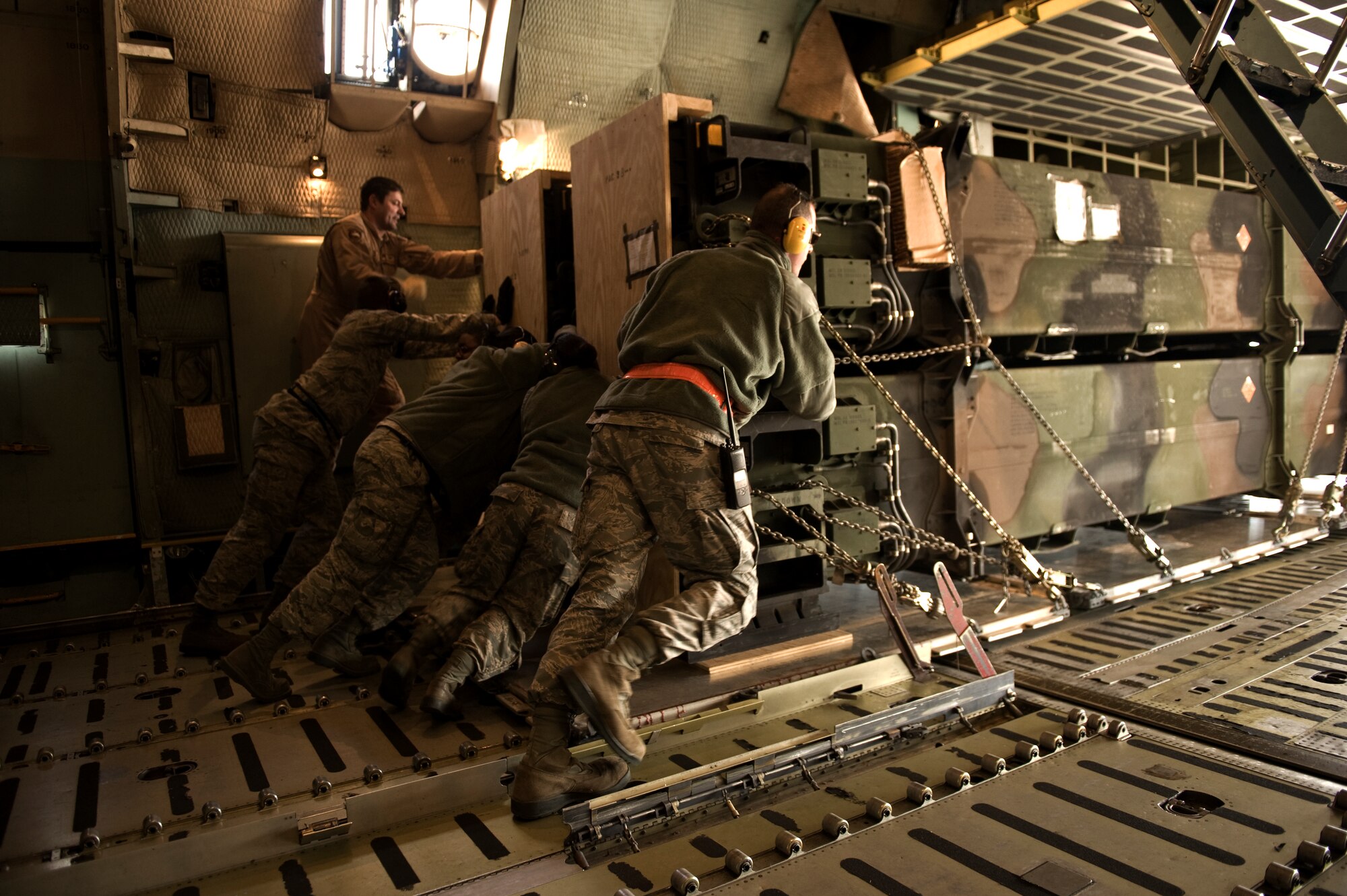 U.S. Air Force Airmen from the 728th Air Mobility Squadron push a pallet containing Patriot missiles onto a truck bed for transport Jan 6, 2013, at Incirlik Air Base, Turkey. Approximately 400 U.S. personnel from the 3rd Battalion, 2nd Air Defense Artillery (3-2 ADA) based at Fort Sill, Okla., will maintain and man the Patriots throughout the duration of their deployment to Turkey. Two Patriot batteries from the United States are deploying to Turkey to support NATO's commitment to Turkey's security. The missiles will augment Turkey's air defense capabilities. (U.S. Air Force photo by Staff Sgt. Marissa Tucker/Released)