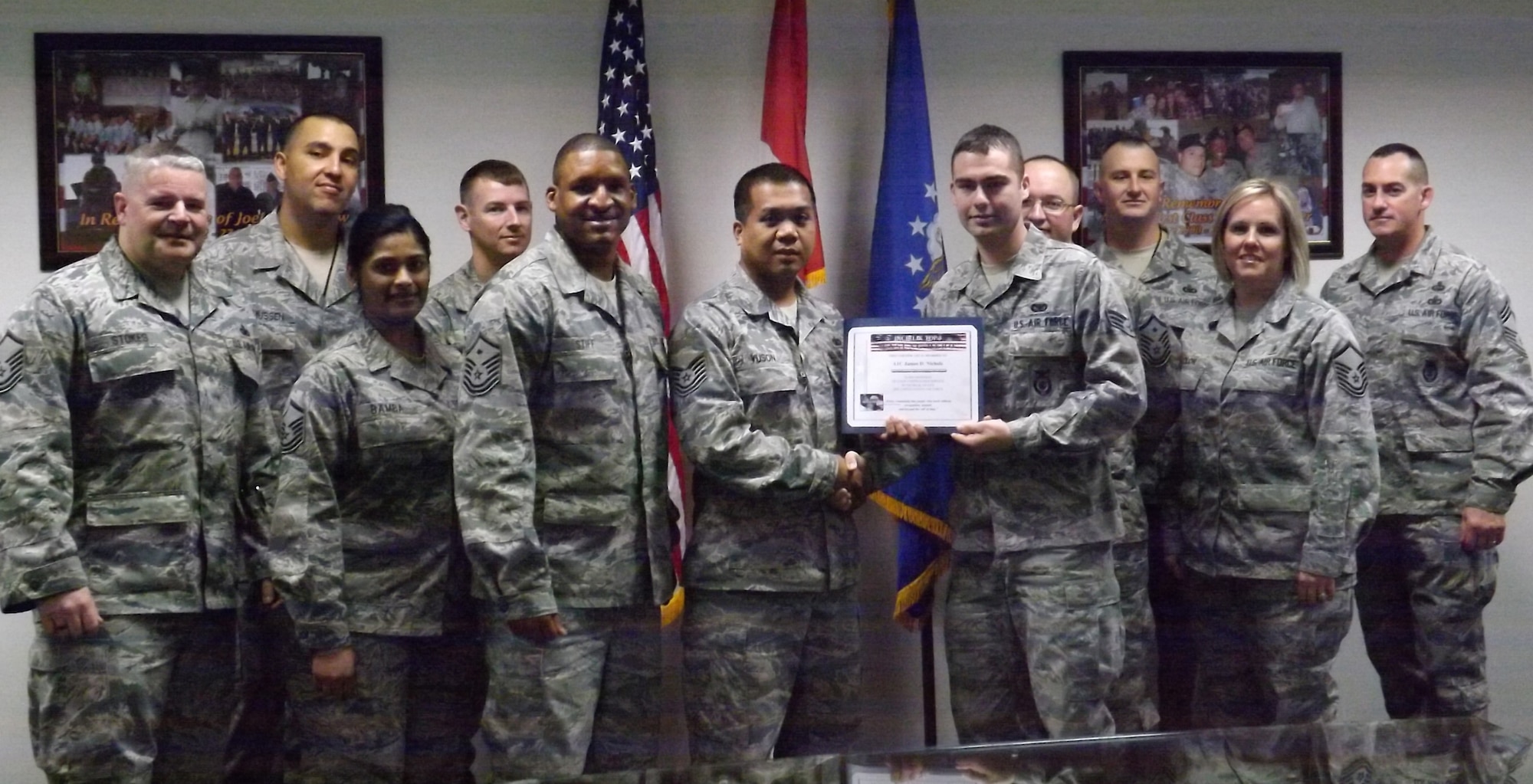 Airman 1st Class James Nichols, 39th Security Forces Squadron, receives the Unsung Hero Award from the Incirlik Top 3 organization Jan. 18, 2013, at Incirlik Air Base, Turkey. The Top 3 presents the Unsung Hero Award monthly to an Airman who demonstrates superior job performance and exceptional leadership. 