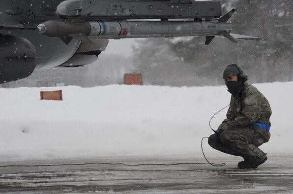 U.S. Air Force Senior Airman Mark Desmond, 14th Aircraft Maintenance Unit dedicated crew chief, makes sure an F-16 Fighting Falcon is ready to leave for Guam at Misawa Air Base, Japan, Jan. 18, 2013. The end-of-runway inspection is a maintainer’s last look over a jet to ensure the safety of the pilot and the efficiency of the aircraft. For the next couple of weeks, over 180 people and approximately 14 jets were assigned to participate in an Aviation Training Relocation exercise. (U.S. Air Force photo by Airman 1st Class Kenna Jackson)