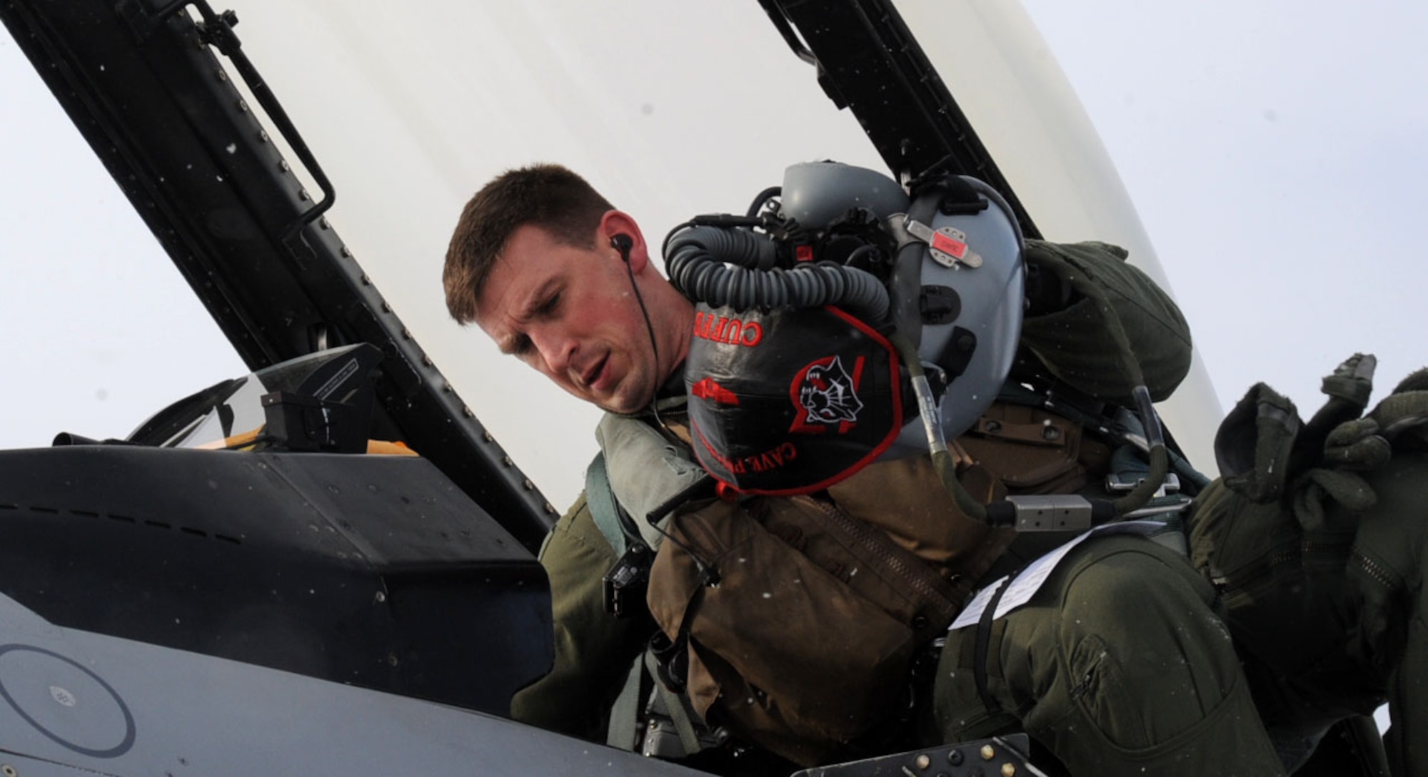U.S. Air Force Capt. Scott Kotowski, 13th Fighter Squadron pilot, steps into his F-16 Fighting Falcon at Misawa Air Base, Japan, Jan. 18, 2013. The 13 FS Panthers are leaving for an Aviation Training Relocation exercise in Guam. (U.S. Air Force photo by Airman 1st Class Kenna Jackson)