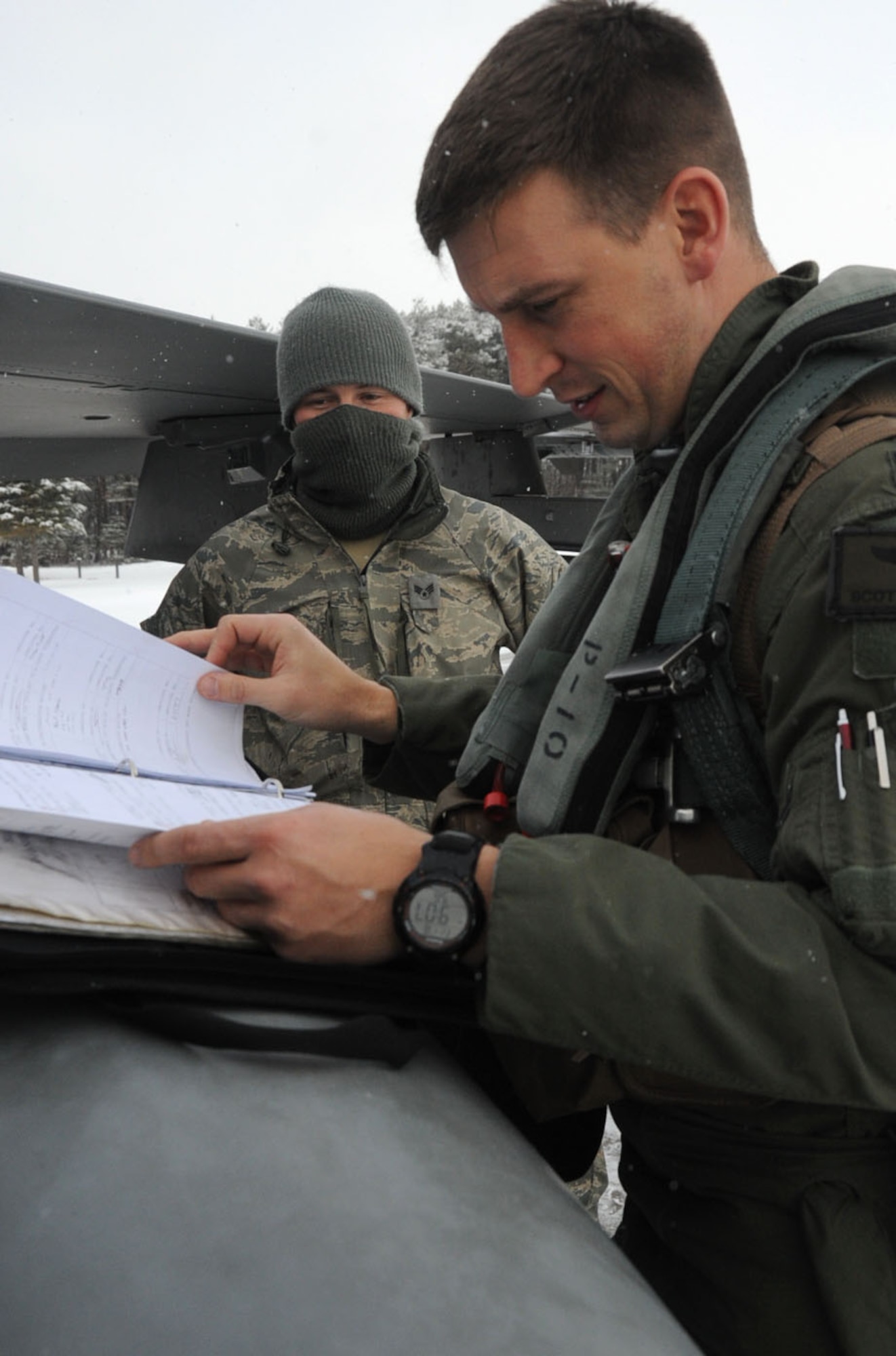 U.S. Air Force Capt. Scott Kotowski, 13th Fighter Squadron pilot, checks the maintenance logs for his F-16 Fighting Falcon before heading to Guam at Misawa Air Base, Japan, Jan. 18, 2013. The Aviation Training Relocation exercise is geared to enhance pilots’ and crew members’ combat skills. (U.S. Air Force photo by Airman 1st Class Kenna Jackson)