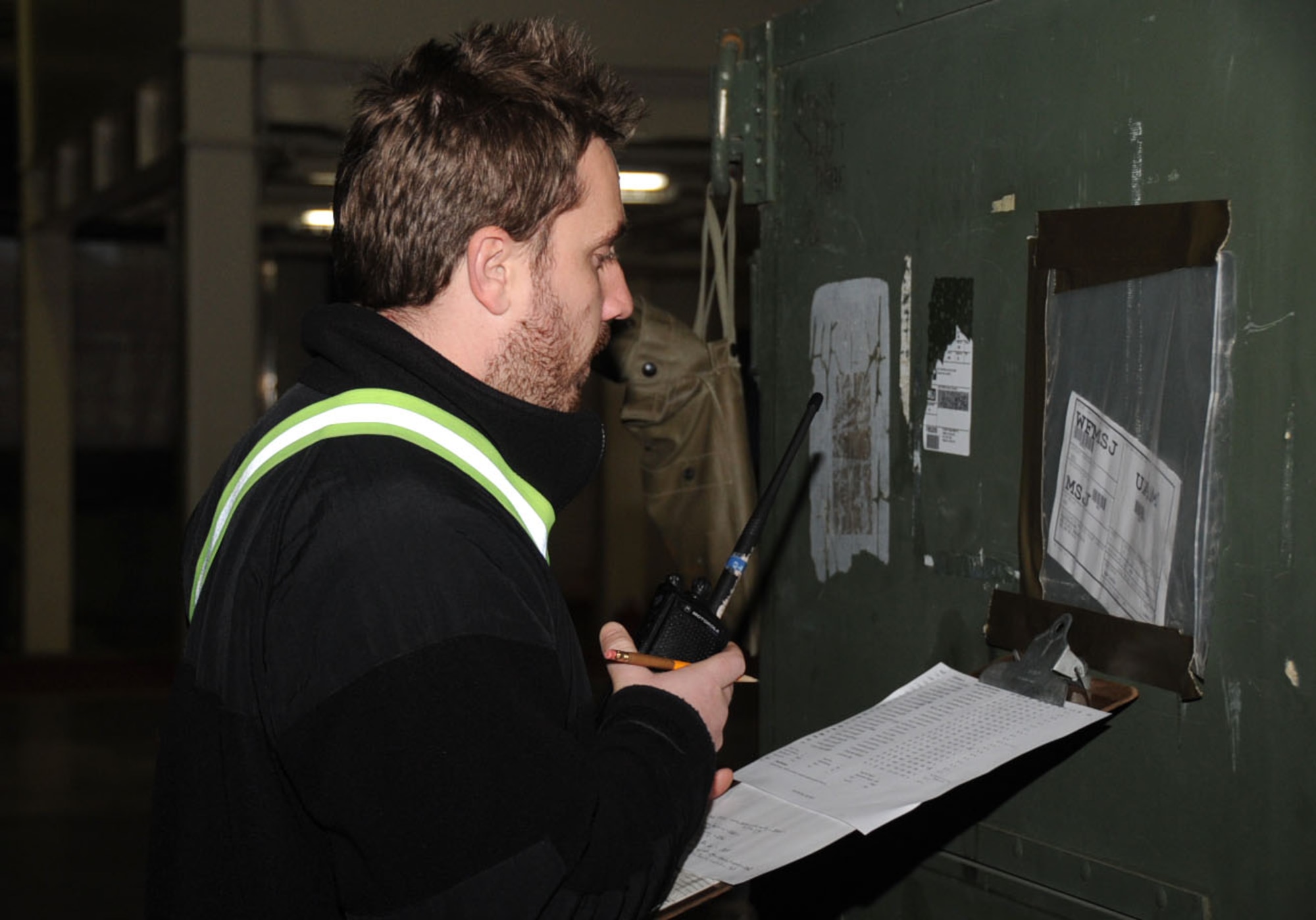 William Wujciak, Civilian Joint Inspection inspector, looks over all cargo in Hangar 949 at Misawa Air Base, Japan, Jan. 14, 2013. Before sending the cargo to Guam for the Aviation Training Relocation exercise, all equipment is inspected and accounted for. (U.S. Air Force photo by Airman 1st Class Kenna Jackson)