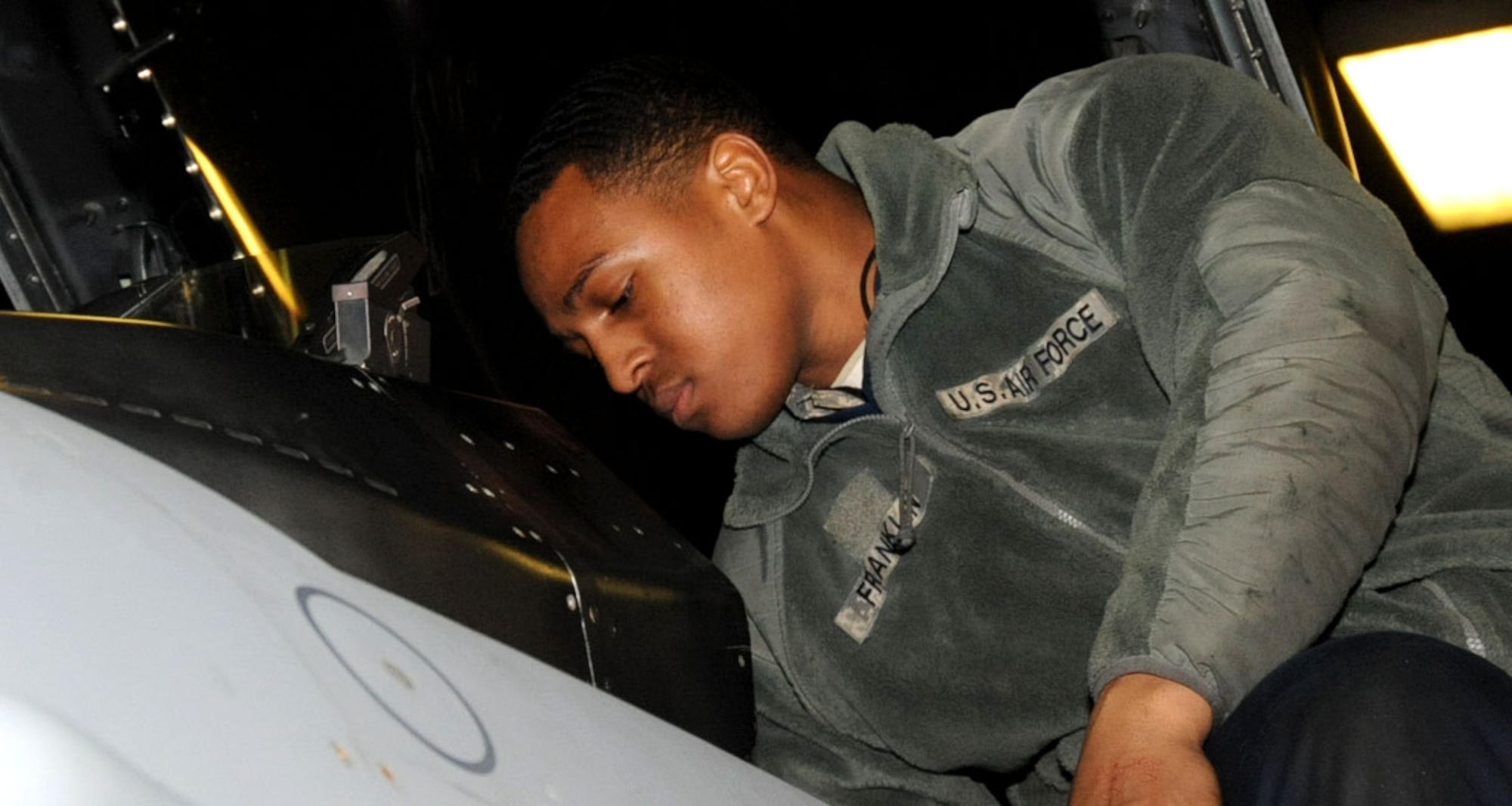 U.S. Air Force Airman Basic Jeremy Franklin, 13th Aircraft Maintenance Unit crew member, prepares an F-16 Fighting Falcon for inspection before it leaves for an Aviation Training Relocation exercise, located in Guam, at Misawa Air Base, Japan, Jan. 11, 2013. The ATR program is designed to increase operational readiness and interoperability between American and Japanese forces. (U.S. Air Force photo by Airman 1st Class Kenna Jackson)
