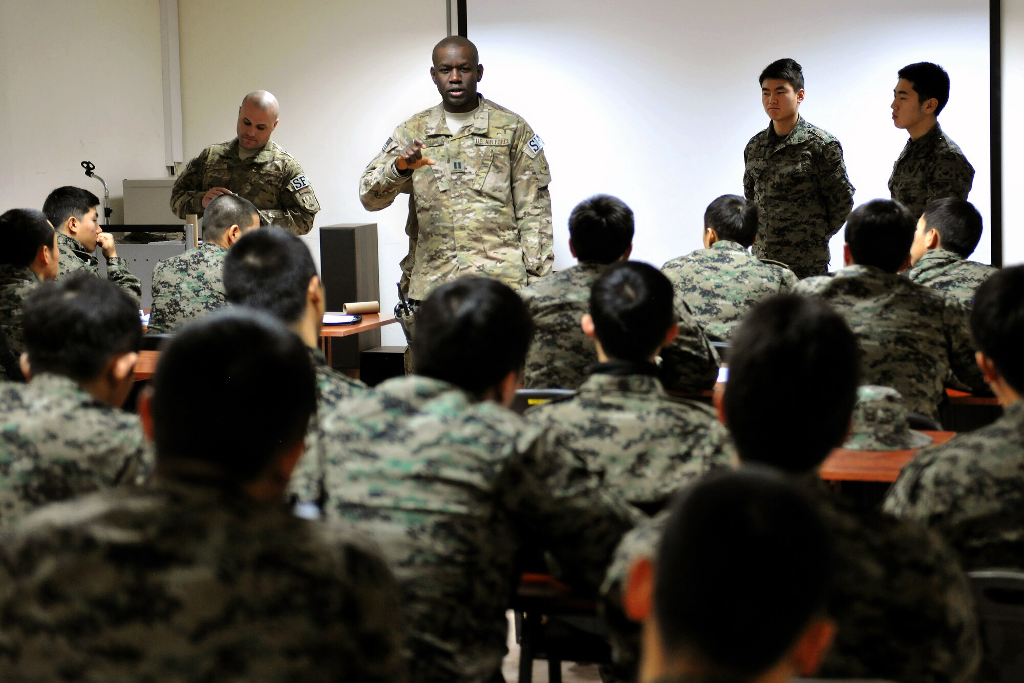 Capt. Schneider Rislin, 455th Expeditionary Security Forces Group officer in charge, instructs a classroom of Republic of Korea Army security forces at Bagram Airfield, Afghanistan, Jan. 16, 2013. The “Use of Force” training was to provide the ROK security forces with some of the same guidelines U.S. forces use in hostile situations.  (U.S. Air Force photo/Senior Airman Chris Willis)