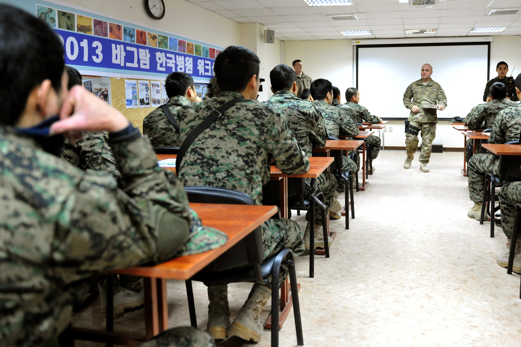 Master Sgt. Thomas Carpino, 455th Expeditionary Security Forces Group bravo sector superintendent, instructs a classroom of Republic of Korea Army security forces at Bagram Airfield, Afghanistan, Jan. 16, 2013.  Members of the ROK security forces and 455th SFG work and train together to secure the airfield’s defense.  (U.S. Air Force photo/Senior Airman Chris Willis)