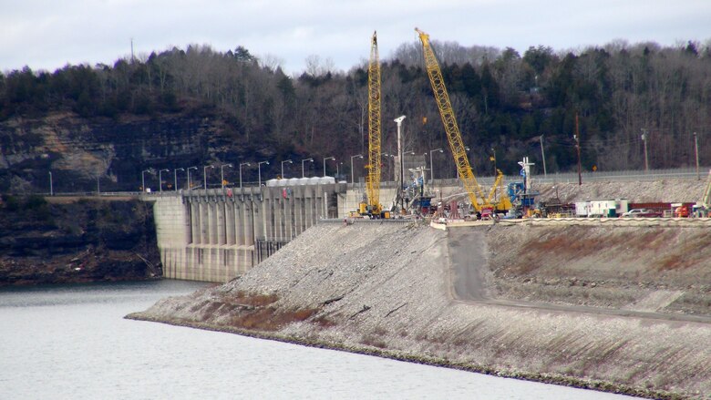 Construction crews work to install a concrete barrier wall Jan. 11, 2013 into the embankment at Wolf Creek Dam in Jamestown, Ky. The U.S. Army Corps of Engineers Nashville District is ahead of schedule on the Wolf Creek Dam Foundation Remediation Project and is now making plans to raise the water level at Lake Cumberland this summer. The barrier wall is currently on track to be completed by the early spring of 2013, which is significantly ahead of the previously planned completion date in December 2013. (USACE photo by Lee Roberts)