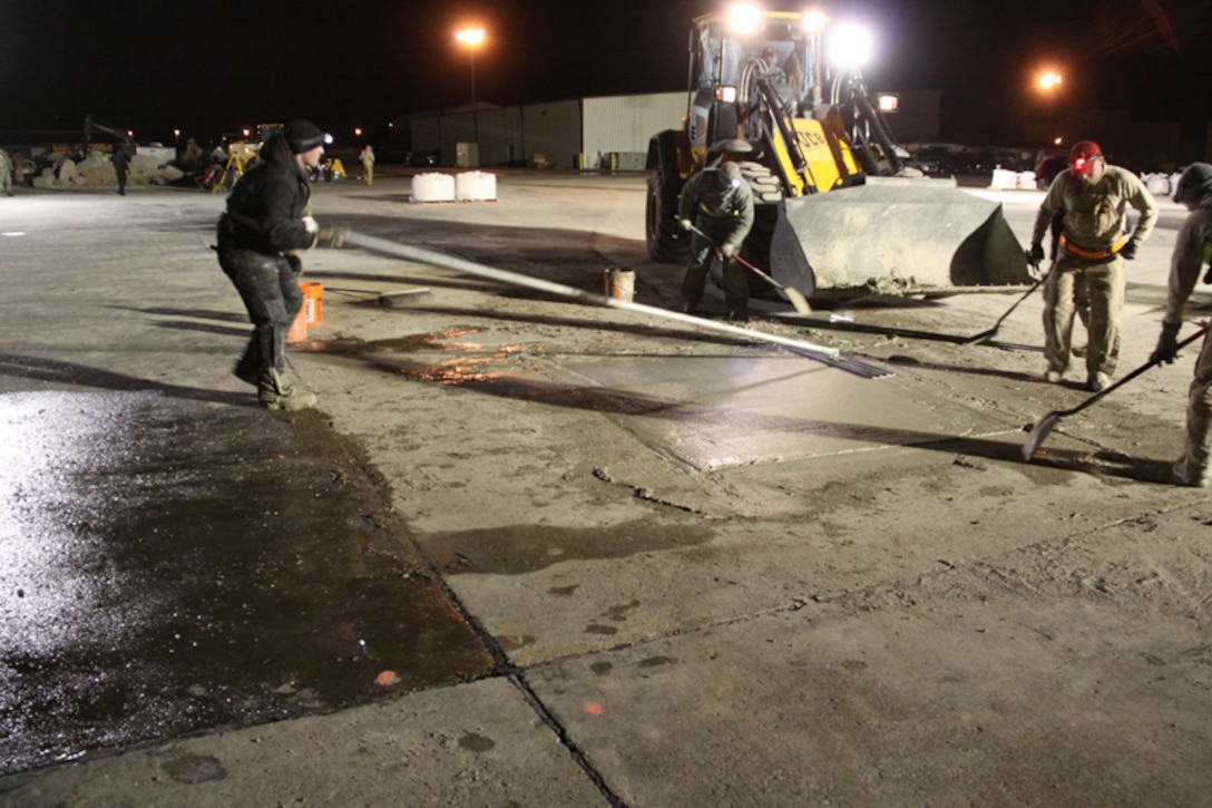 Another look at RED HORSE practicing screeding in preparation for cold weather demo at Malmstrom.