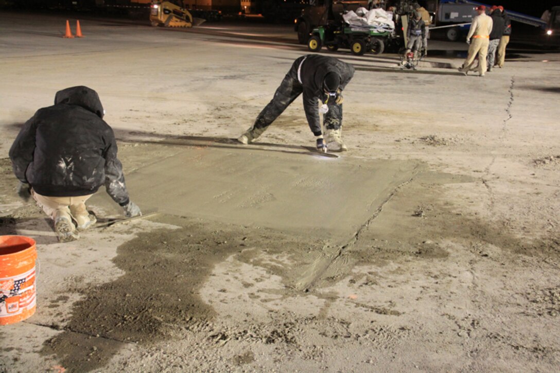 Another view, screeding practice by RED HORSE members. 