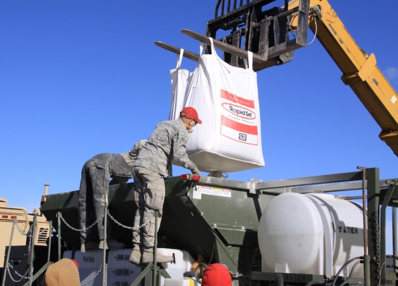 RED HORSE team members practice using the materials, equipment and methods to repair craters.