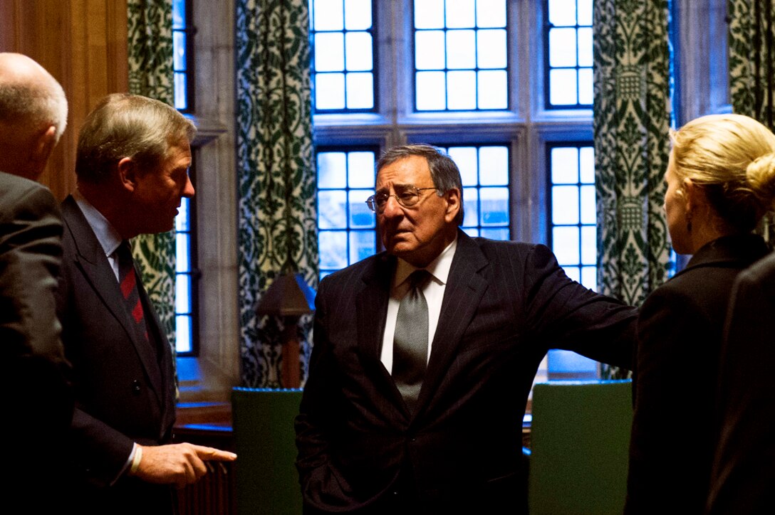 Andrew Robathan, minister of state for the U.K.'s armed forces, gives U.S. Defense Secretary Leon E. Panetta, center, a tour of the House of Commons in London, Jan. 18, 2013.