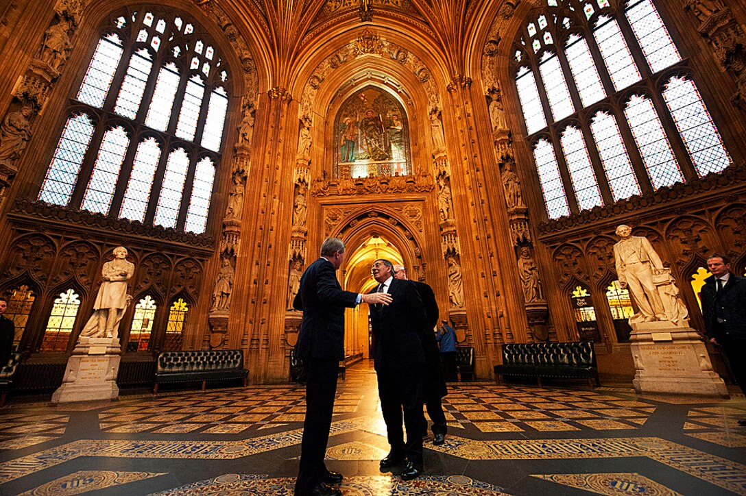 Andrew Robathan, minister of state for the U.K.'s armed forces, gives U.S. Defense Secretary Leon E. Panetta, center, a tour of the Palace of Westminster in London, Jan. 18, 2013.