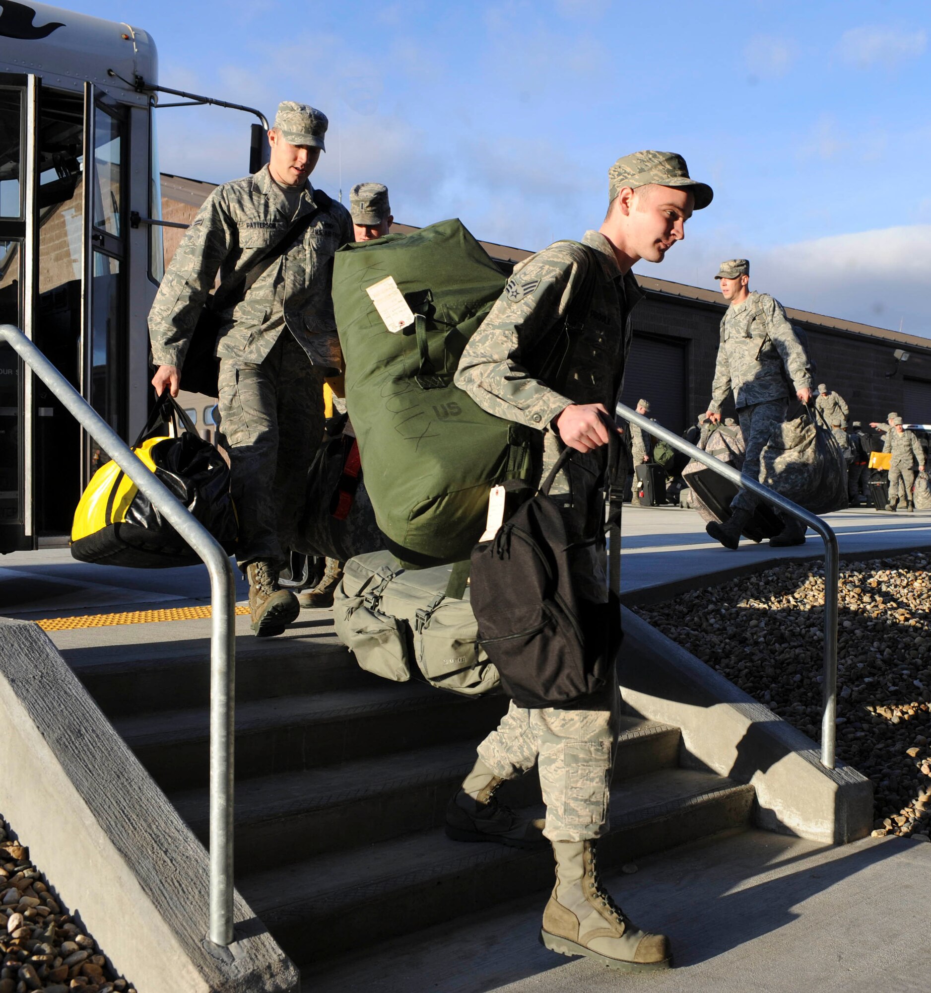 Ellsworth Airmen prepare to enter the deployment center at Ellsworth Air Force Base, S.D., Jan. 19, 2013. Approximately 350 Airmen will deploy to Southwest Asia to support missions in the U.S. Central Command area of responsibility. (U.S. Air Force photo by Airman 1st Class Anania Tekurio/Released)  