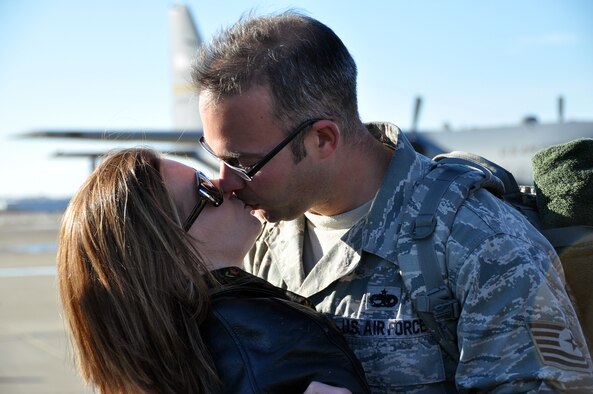 Tech. Sgt. Christopher Lindsey, a maintainer with the 911th Maintenance Support Squadron, greets his wife, Amanda Lindsey, with an emotional kiss at their reunion Jan. 18, 2013, on the Pittsburgh International Airport Air Reserve Station flightline, which concluded a four-month long overseas deployment. Over a two-day span, the 911th Airlift Wing safely returned 108 of its Steel City Airmen warrior force, capping off an award winning deployment to Southwest Asia. The Wing’s personnel and two unit equipped C-130s Operations and Maintenance Air Expeditionary Force support package, directly supported Operation Enduring Freedom, delivering critical supplies, equipment, and U.S. and coalition forces within the U. S. Central Command’s area of operations. Within the last five years alone the 911th Airlift Wing’s Steel City Airmen have deployed to over 80 locations throughout the world providing critical support within each of the seven geographical Combatant Commands (COCOMS).  When multiplied by the number of days encompassing each member’s deployment the men and women of the 911th provided 337,151 days of support to the warfighter.  With the return of this AEF package, the 911th still will have over 50 members deployed globally in support of our national security objectives. (U.S. Air Force photo by Capt. Shawn M. Walleck)