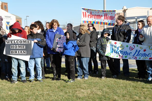 Family and friends gathered outside on the flightline of the Pittsburgh International Airport Air Reserve Station, Jan 18, 2013, ready to welcome home unit members. Over a two-day span, the 911th Airlift Wing safely returned 108 of its Steel City Airmen warrior force, capping off an award winning four-month long deployment to Southwest Asia. The Wing’s personnel and two unit equipped C-130s Operations and Maintenance Air Expeditionary Force support package, directly supported Operation Enduring Freedom, delivering critical supplies, equipment, and U.S. and coalition forces within the U. S. Central Command’s area of operations. (U.S. Air Force photo by Capt. Shawn M. Walleck/Released)