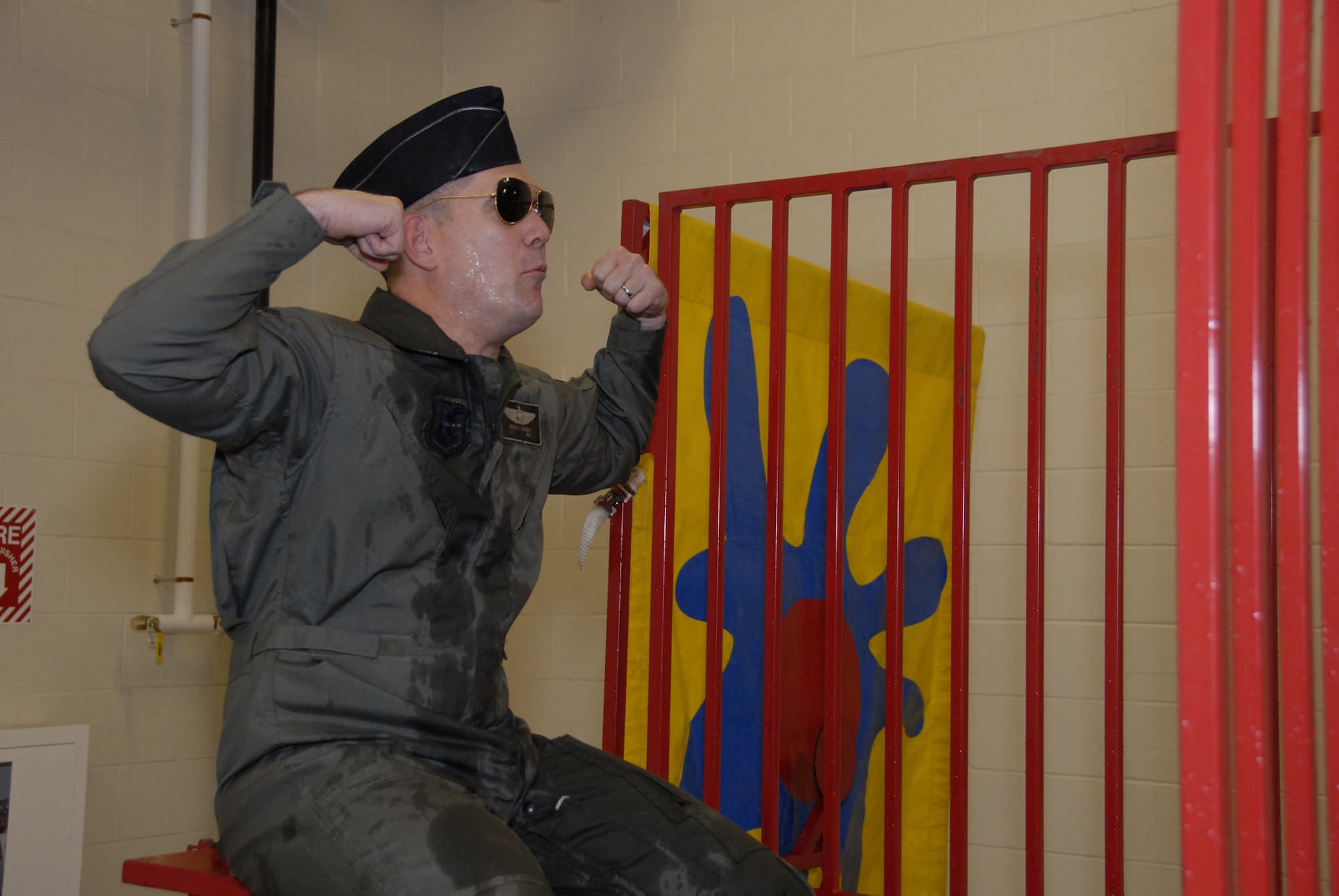 Col. Jerry McDonald, 103rd Maintenance Group commander, taunts fellow Flying Yankees Dec. 2, 2012, as they try to send him swimming in a Dunk Tank as part of a fundraiser to benefit the Wounded Warrior Project during the unit’s Christmas party at Bradley Air National Guard Base, East Granby, Conn. (U.S. Air Force photo by Master Sgt. Erin McNamara)