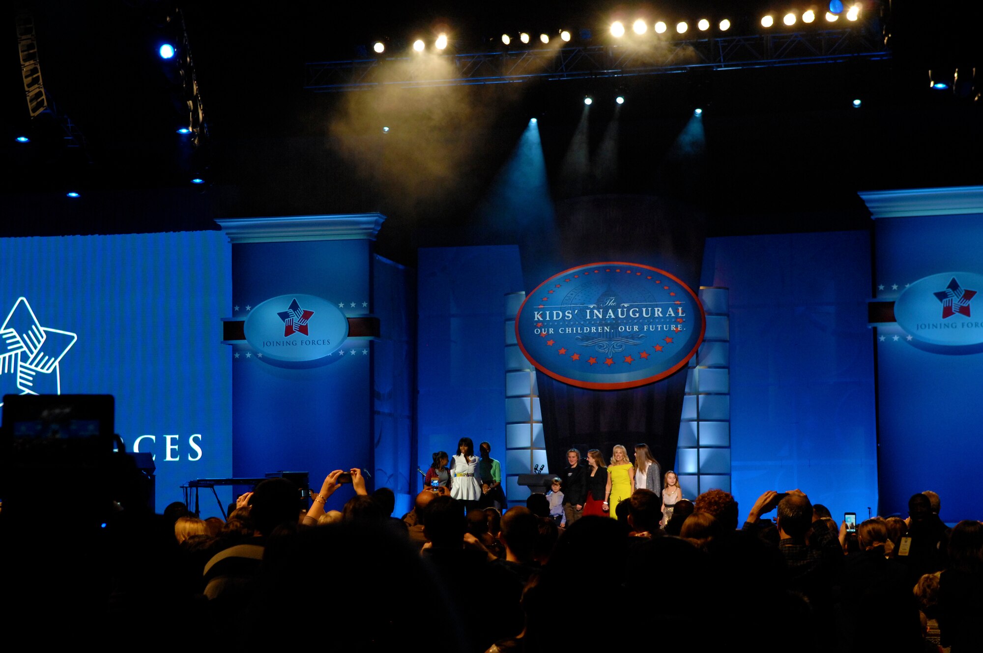 First Lady Michelle Obama and her daughters, and Dr. Jill Biden, wife of Vice President Joe Biden, and her grandchildren, come out on stage during the Kids’ Inaugural Concert at the Walter E. Washington Convention Center in Washington, D.C., Jan. 19, 2013. (DOD photo/Army Sgt. 1st Class Tyrone C. Marshall Jr.) 