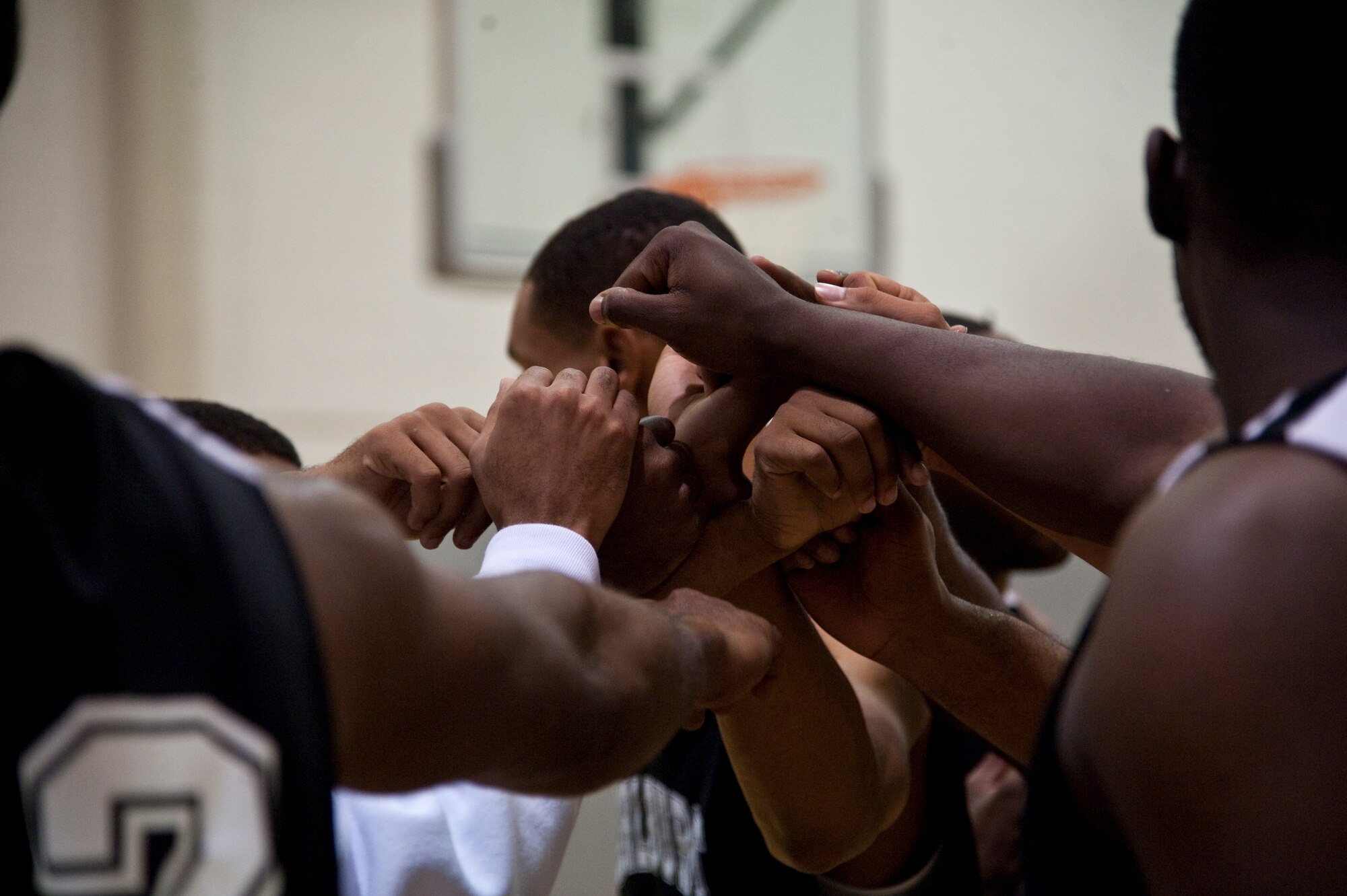The Hurlburt Field Commandos basketball team, huddle during a time-out at the Aderholt Fitness Center on Hurlburt Field, Fla., Jan. 21, 2013. Hurlburt Field held the basketball tournament to commemorate and celebrate Martin Luther King Day. (U.S. Air Force photo/ Airman 1st Class Nigel Sandridge)