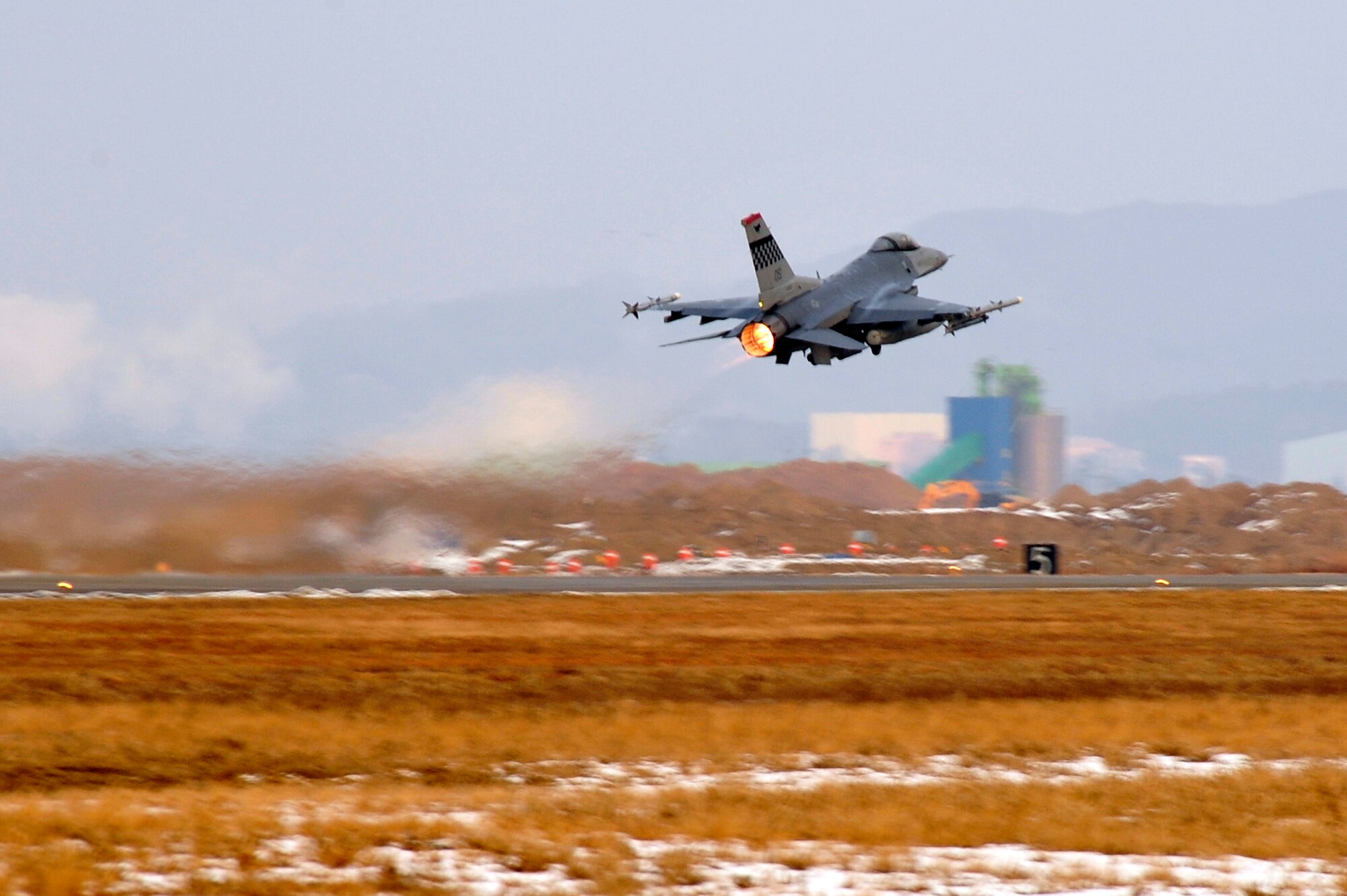 An F-16 Fighting Falcon takes off for an exercise sortie during operational readiness exercise Beverly Midnight 13-01 at Osan Air Base, Republic of Korea, Jan. 16, 2013. BM 13-01 is the first ORE of the New Year to prepare Airmen for the Consolidated Unit Inspection in April. (U.S. Air Force photo/Airman 1st Class Alexis Siekert)