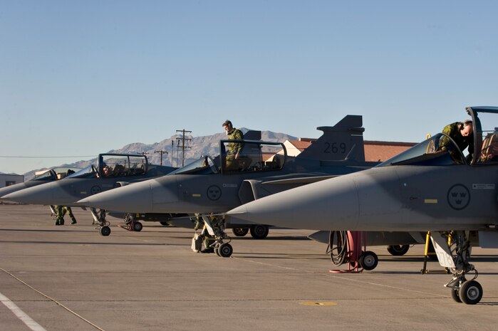 NELLIS AIR FORCE BASE, Nev. – Technicians from the 172nd Fighter Reconnaissance Squadron perform post flight checks after the arrival of their JAS-39 Gripen fighter jets at Nellis Air Force Base, Nev., to participate in RED FLAG 13-2 Jan. 17, 2013. This mock battle training in the skies over the Nevada Test and Training Range has yielded results that increase the combat capability of U.S. and allied air forces for potential combat situations. (U.S. Air Force photo by Senior Airman Matthew Lancaster)
