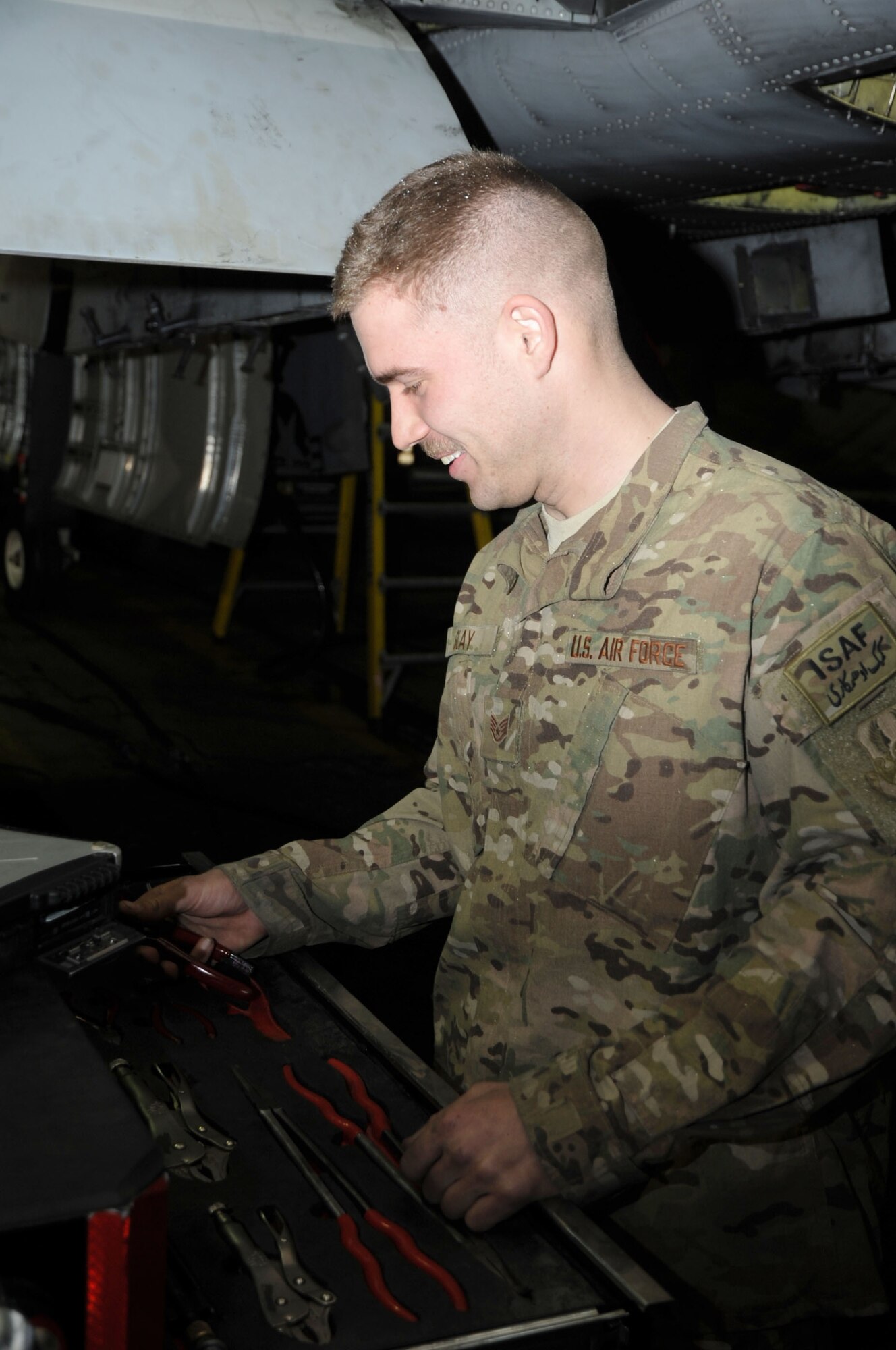 Staff Sgt. Sean Slay, 455th Expeditionary Aircraft Maintenance Squadron avionics systems craftsman, selects tools for maintenance work on an A-10 Thunderbolt II aircraft on Bagram Airfield, Afghanistan, Jan. 16, 2013. Slay supervises the maintenance of targeting pods on the A-10, coordinating all inspections and part replacement. (U.S. Air Force photo/Staff Sgt. David Dobrydney)