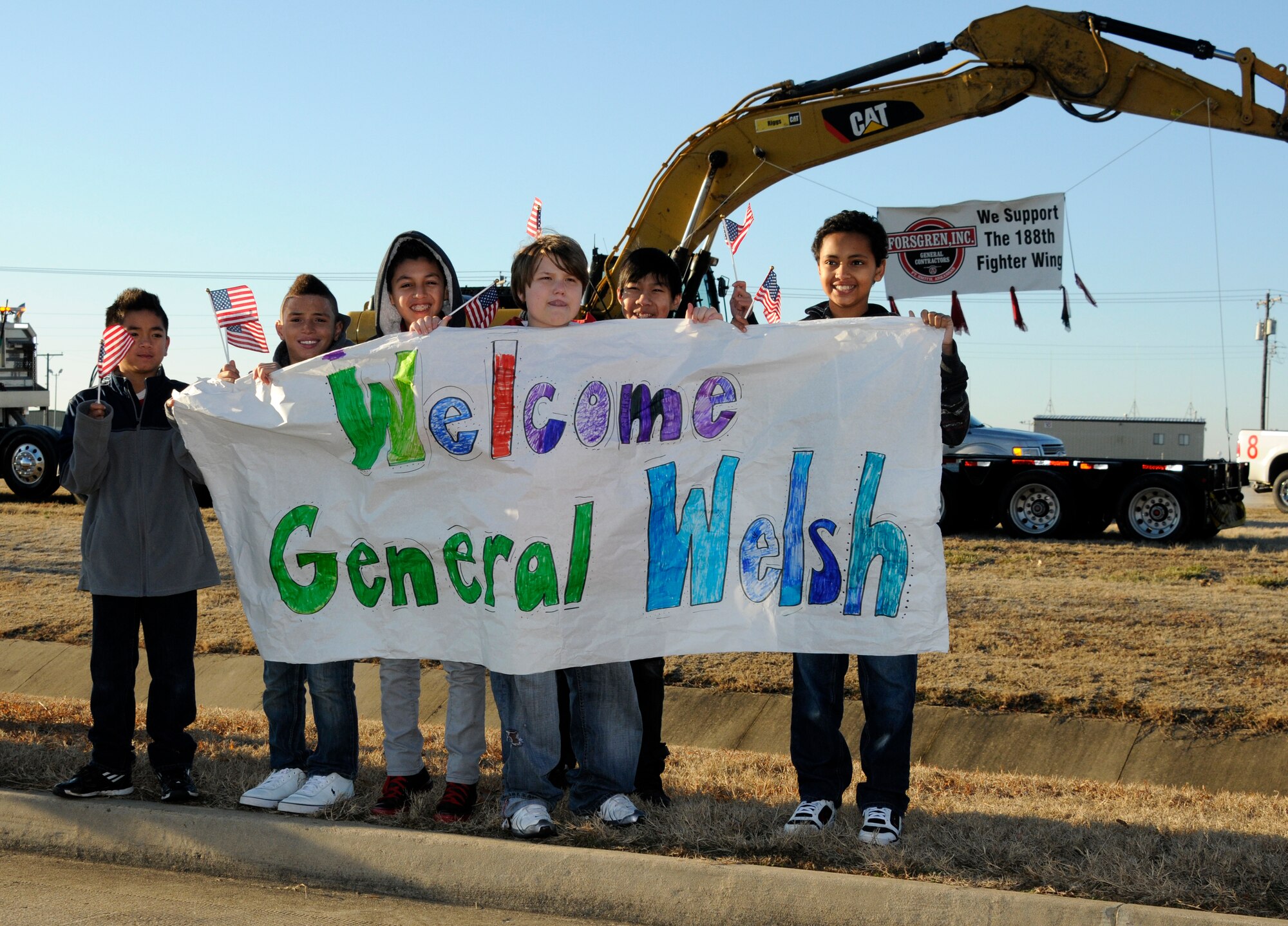 Members of the Fort Smith, Ark., community gathered outside the gate of the 188th Fighter Wing to show their support of the 188th and to welcome Chief of Staff of the Air Force Gen. Mark A Welsh III, Jan. 18, 2013. Welsh toured the 188th’s facilities and learned about the unit’s mission. He also discussed the 188th’s future with 188th and state military leadership as well as members of the Oklahoma and Arkansas Congressional delegation. Welsh also met with city officials and community leaders during a Jan. 17 gathering in Fort Smith. (National Guard photo by Senior Airman Hannah Landeros/188th Fighter Wing Public Affairs)