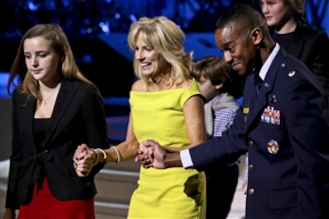 U.S. Air Force Lt. Col. Brian Salley escorts Dr. Jill Biden, wife of Vice President Joe Biden, to her seat during the Kids' Inaugural concert in Washington, D.C., Jan. 19, 2013. Dr. Biden co-hosted the event with First Lady Michelle Obama for U.S. service members and their families.
