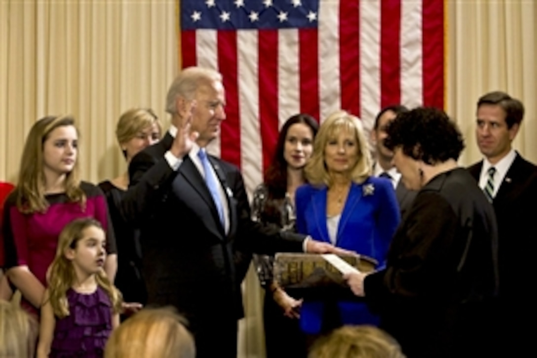 Supreme Court Associate Justice Sonya Sotomayor administers the oath of office to Vice President Joe Biden during the official swearing-in ceremony with family members at the Naval Observatory residence in Washington, D.C., Jan. 20, 2013. Dr. Jill Biden holds the Biden family Bible.