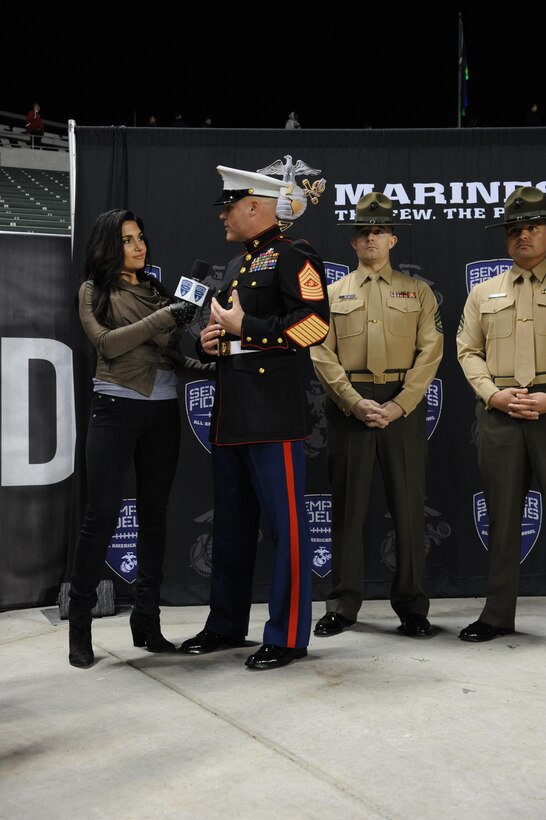 Molly Qerim interviews Sgt. Maj. Micheal P. Barrett, the 17th Sergeant Major of the Marine Corps, at the 2013 Semper Fidelis All-American Bowl in Anaheim, Calif., Jan. 4, 2013. (U.S. Marine Corps photo by Lance Cpl. Thomas DeMelo)