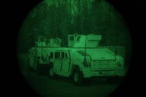 Two Humvees take the lead in a night training convoy conducted by 2nd Supply Battalion, 2nd Marine Logistics Group at Camp Lejeune’s Home Station Training Lanes in Holly Ridge, N.C., Jan. 16, 2013. Six vehicles carefully traversed a route through the darkness with the help of the unit’s command operations center, which guided the convoy through a series of waypoints established prior to their mission.