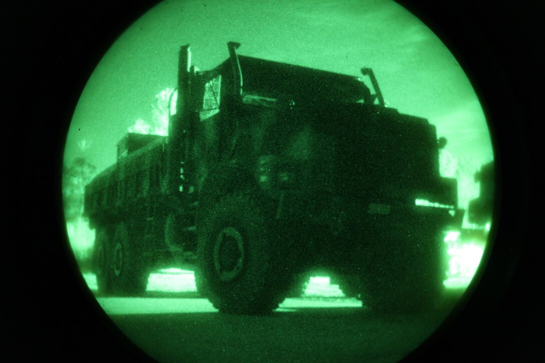 A seven-ton truck waits to set out on a night training convoy conducted by 2nd Supply Battalion, 2nd Marine Logistics Group at Camp Lejeune’s Home Station Training Lanes in Holly Ridge, N.C., Jan. 16, 2013. The unit used six vehicles to conduct the convoy at the training site, where they honed their night-time navigation and communication skills.