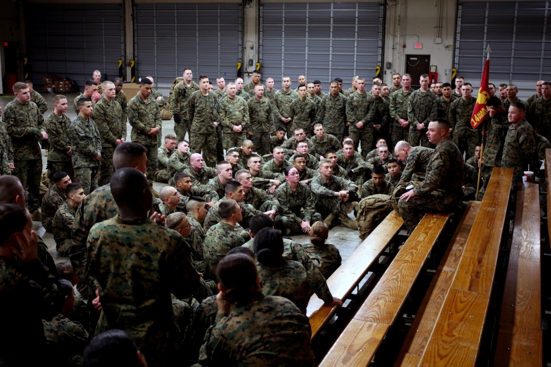 Marines with Headquarters Battery, 14th Marine Regiment, 4th Marine Division, receive a briefing after a three-mile morning hike at Naval Air Station Fort Worth Joint Reserve Base, Texas, Jan 13, 2013. Marines from the regiment’s headquarters and the motor transport and communications sections hiked just over three miles with loaded packs as part of an exercise that promotes unit cohesion and morale.  The hike was the first of several that the unit plans to organize this year. 14th Marines will support a variety of exercises and operations in 2013, including Ulchi Freedom Guardian.  UFG is a defense-oriented, routine exercise that enhances the ability of the Republic of Korea-U.S. alliance to deter against external aggression and maintain stability on the Korean peninsula. (U.S. Marine Corps Photo by Lance Cpl. Kirstin Henning/Released)