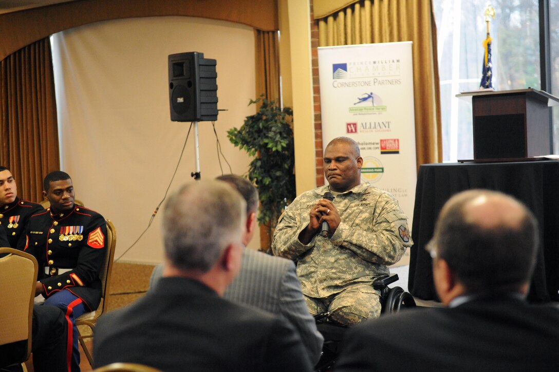 Col. Gregory D. Gadson, garrison commander, Fort Belvoir, gives a speech during the Salute to the Armed Services presentation by the Prince William Chamber of Commerce at the Harbour View on Jan. 16. Gadson was the keynote speaker for the ceremony.